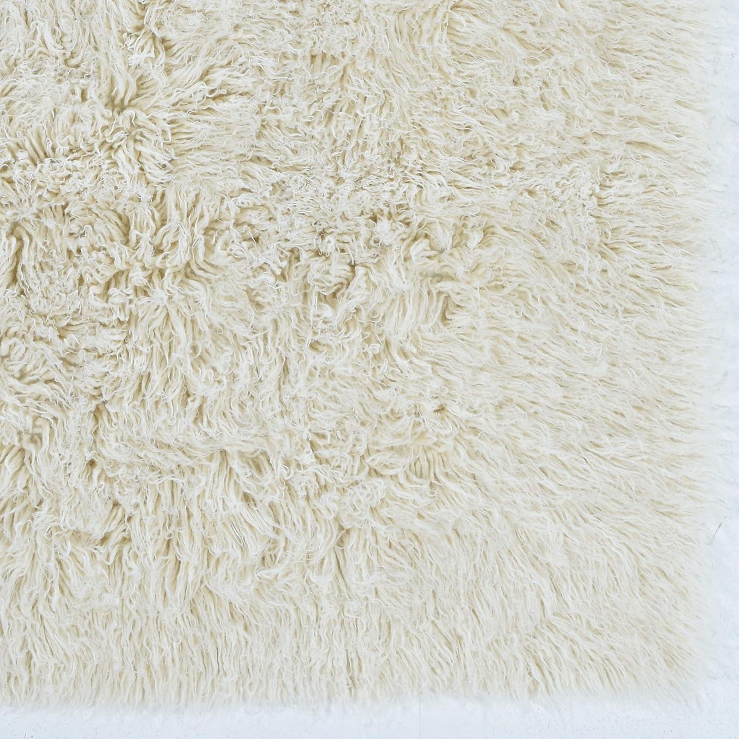Ebern Designs Aaiden Flokati Wool Shag Hand Loomed Ivory Rug