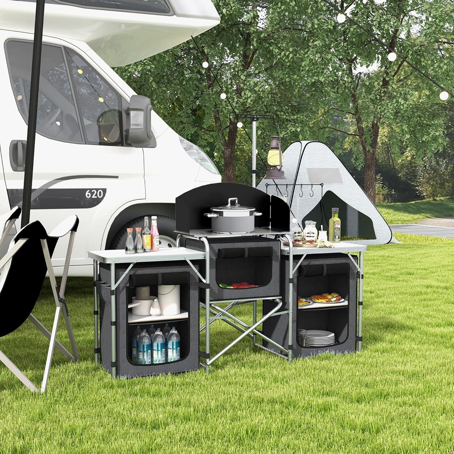Outsunny Camping Kitchen Table, Portable Folding Camp Kitchen, Aluminum Cook Station with 3 Fabric Cupboards, Windshield, Carrying Bag, Black