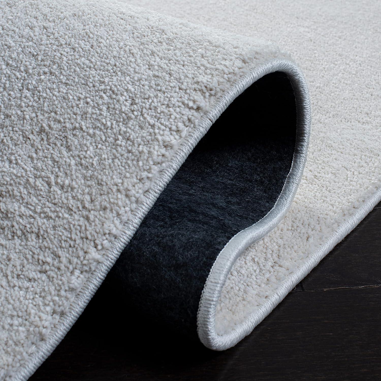 SAFAVIEH Plain and Solid Carleen Solid Plush Area Rug, Ivory, 4'5" x 6'5"