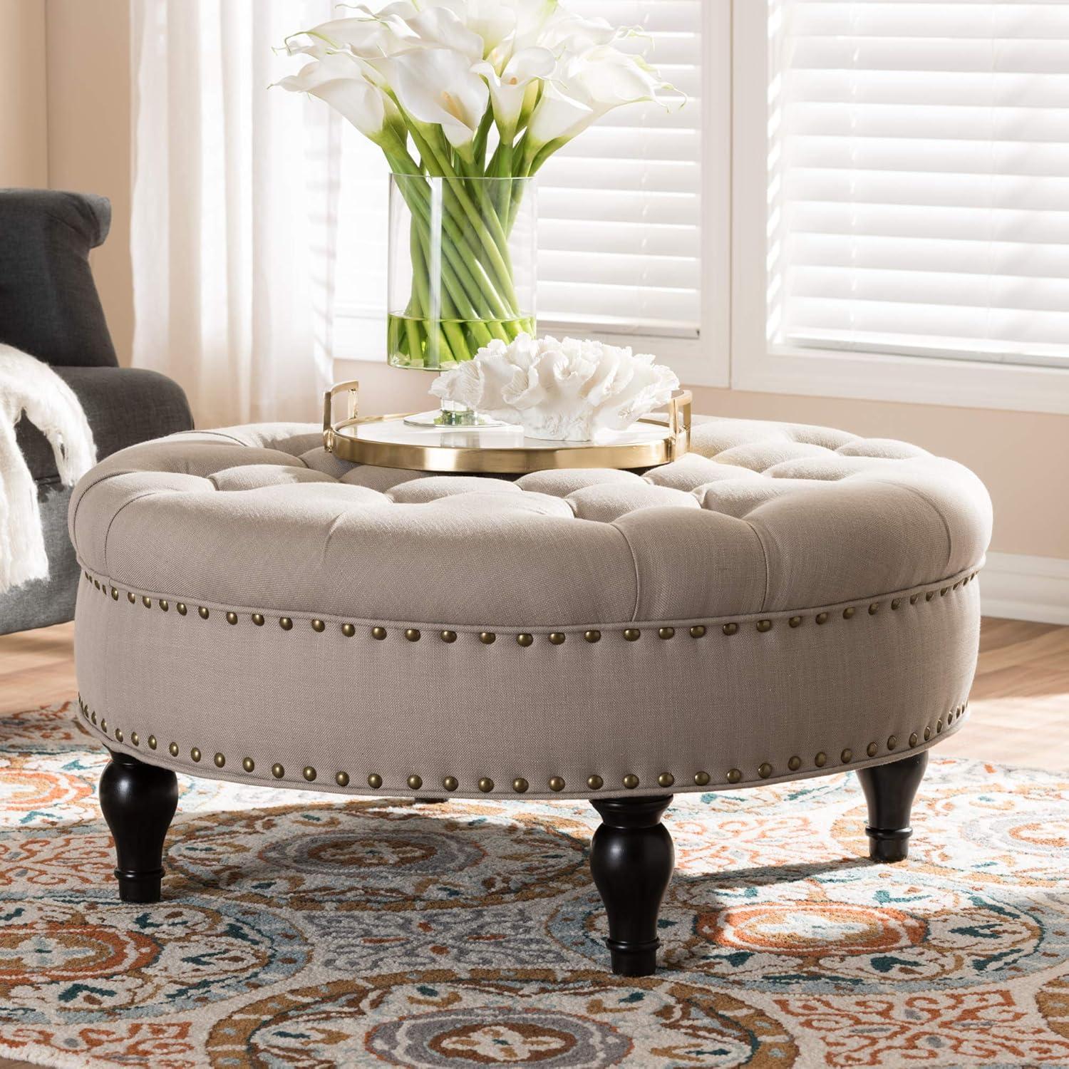 Gray Linen Tufted Round Ottoman with Brass Nailhead Trim