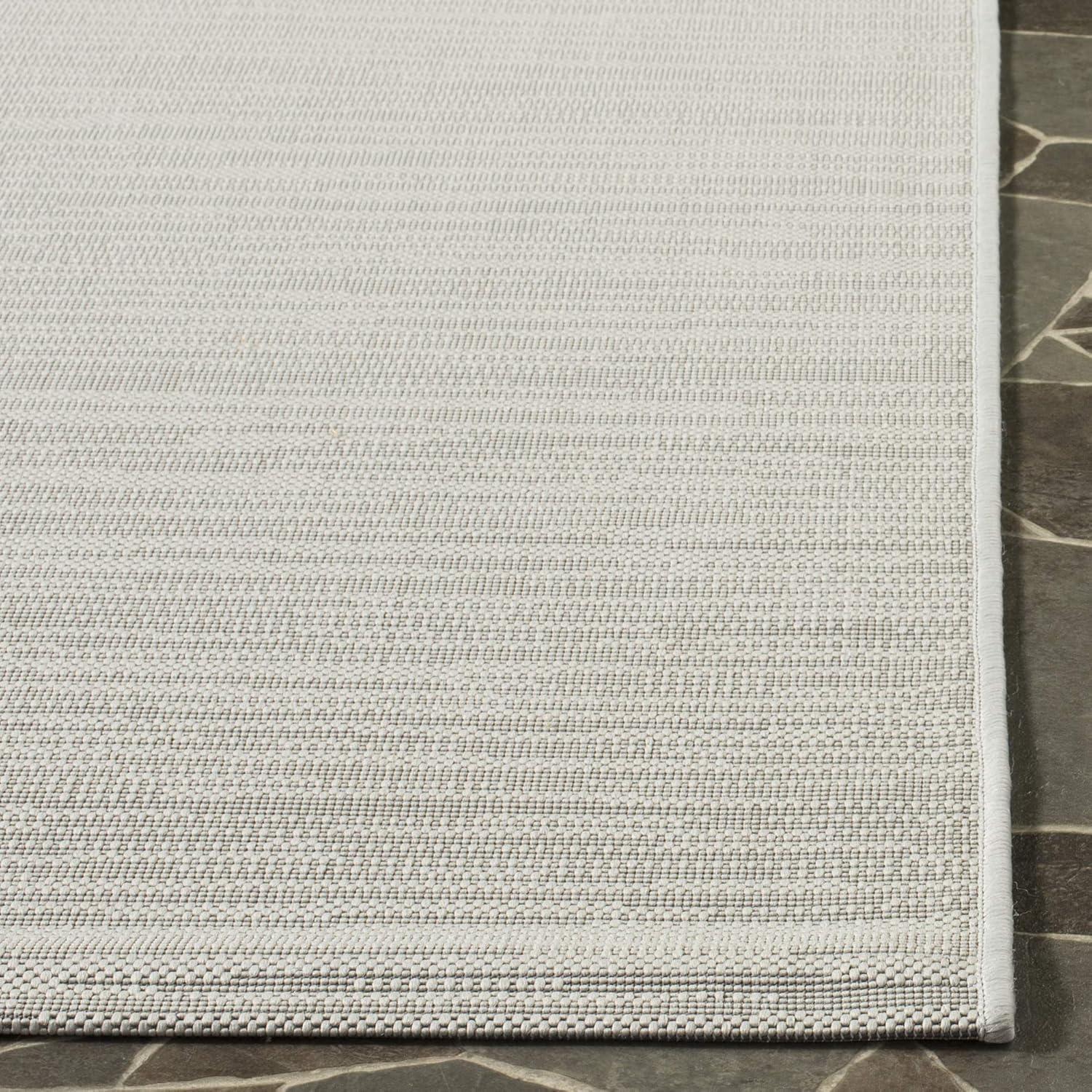 Easy-Care Reversible Light Grey Synthetic Area Rug, 4' x 5'7"