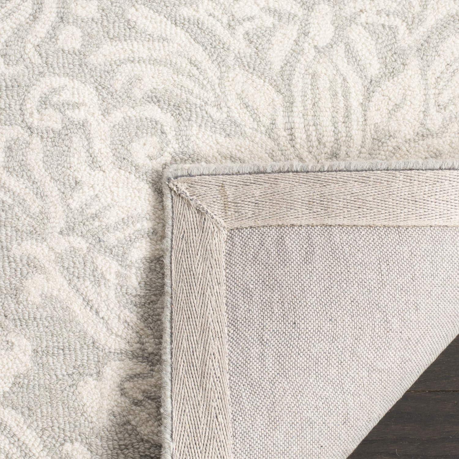 Handmade Floral Bliss Blue/Ivory Wool 5' x 8' Tufted Area Rug