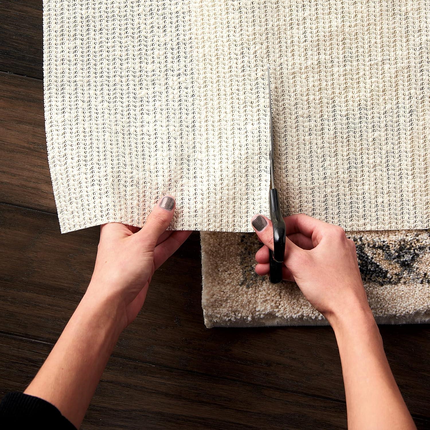 Ebern Designs Rectangle Shiftloc Solid Color Machine Made Polyester/Plastic/Acrylic Area Rug in Ivory