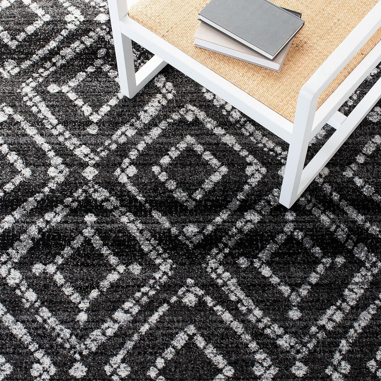 Black and Ivory Geometric Synthetic Rectangular Area Rug