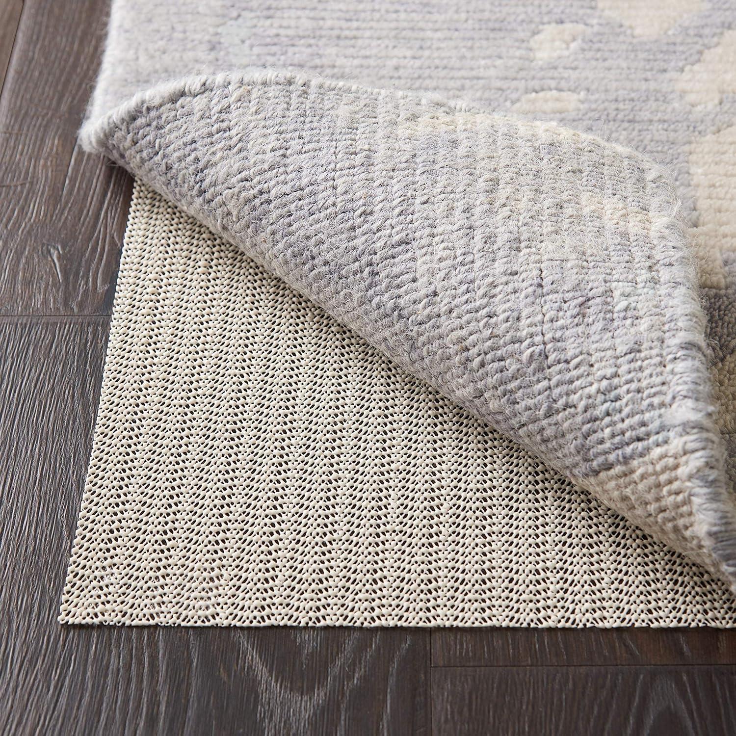 Ebern Designs Rectangle Shiftloc Solid Color Machine Made Polyester/Plastic/Acrylic Area Rug in Ivory