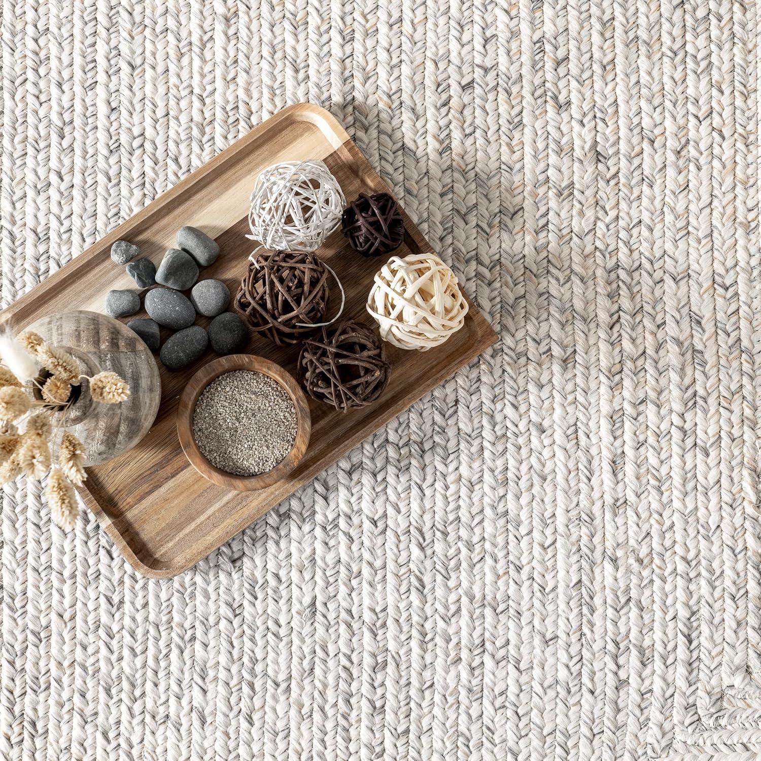 Handmade Ivory Synthetic 5x8 Oval Braided Rug