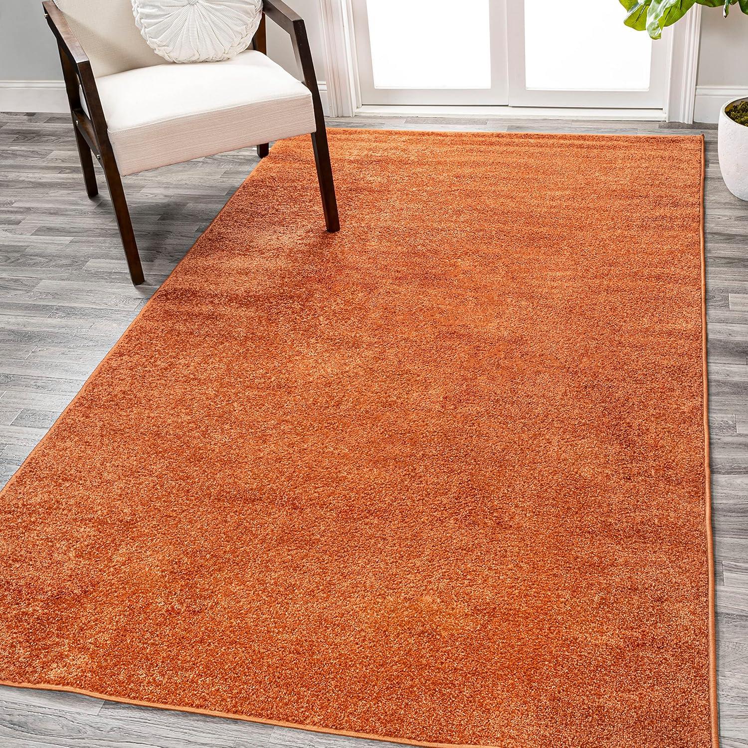 Haze Solid Low-Pile Orange 10 ft. x 14 ft. Area rug -JONATHAN Y