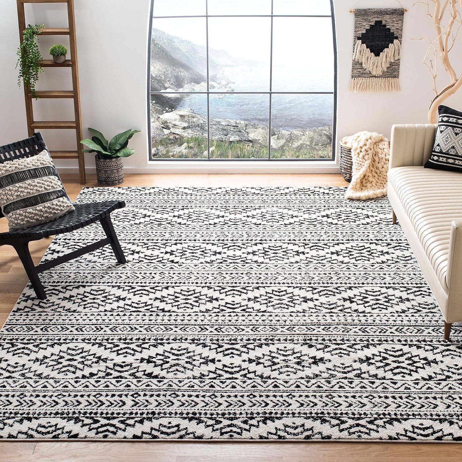 Ivory and Black Geometric Synthetic 9' x 12' Area Rug