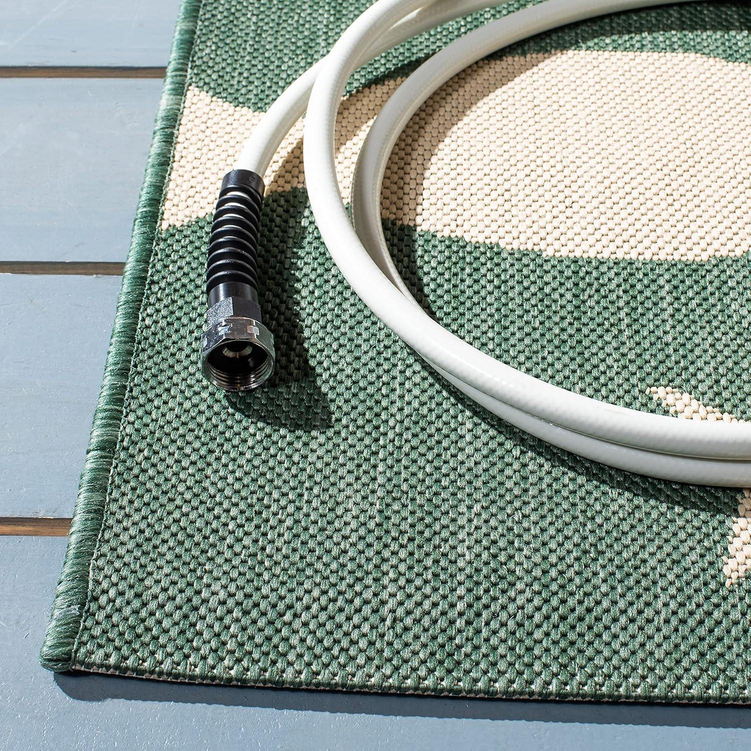 Elegant Dark Green and Ivory Synthetic Indoor/Outdoor Rug - 4' x 5'7"