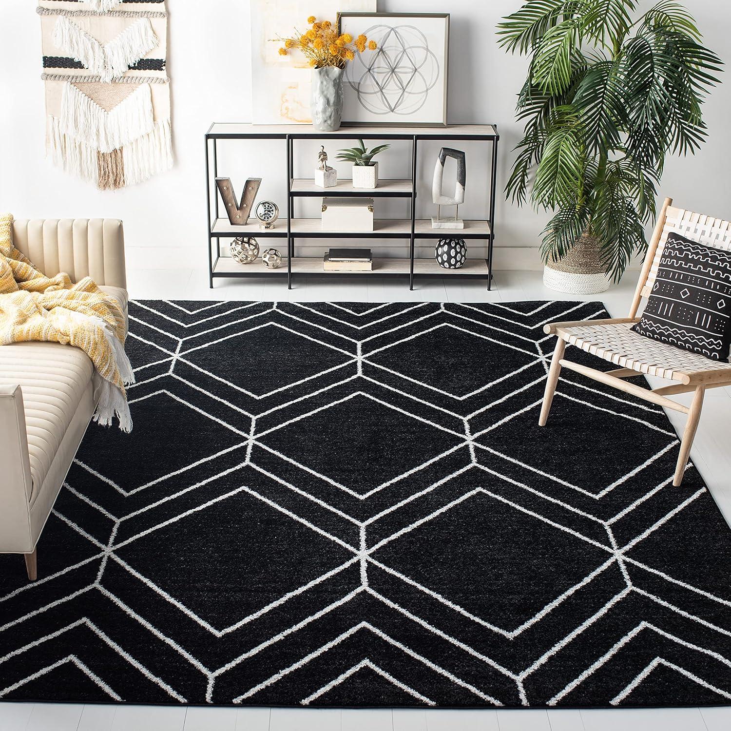 Braided Round Black and Ivory Synthetic Rug, 4' x 6'