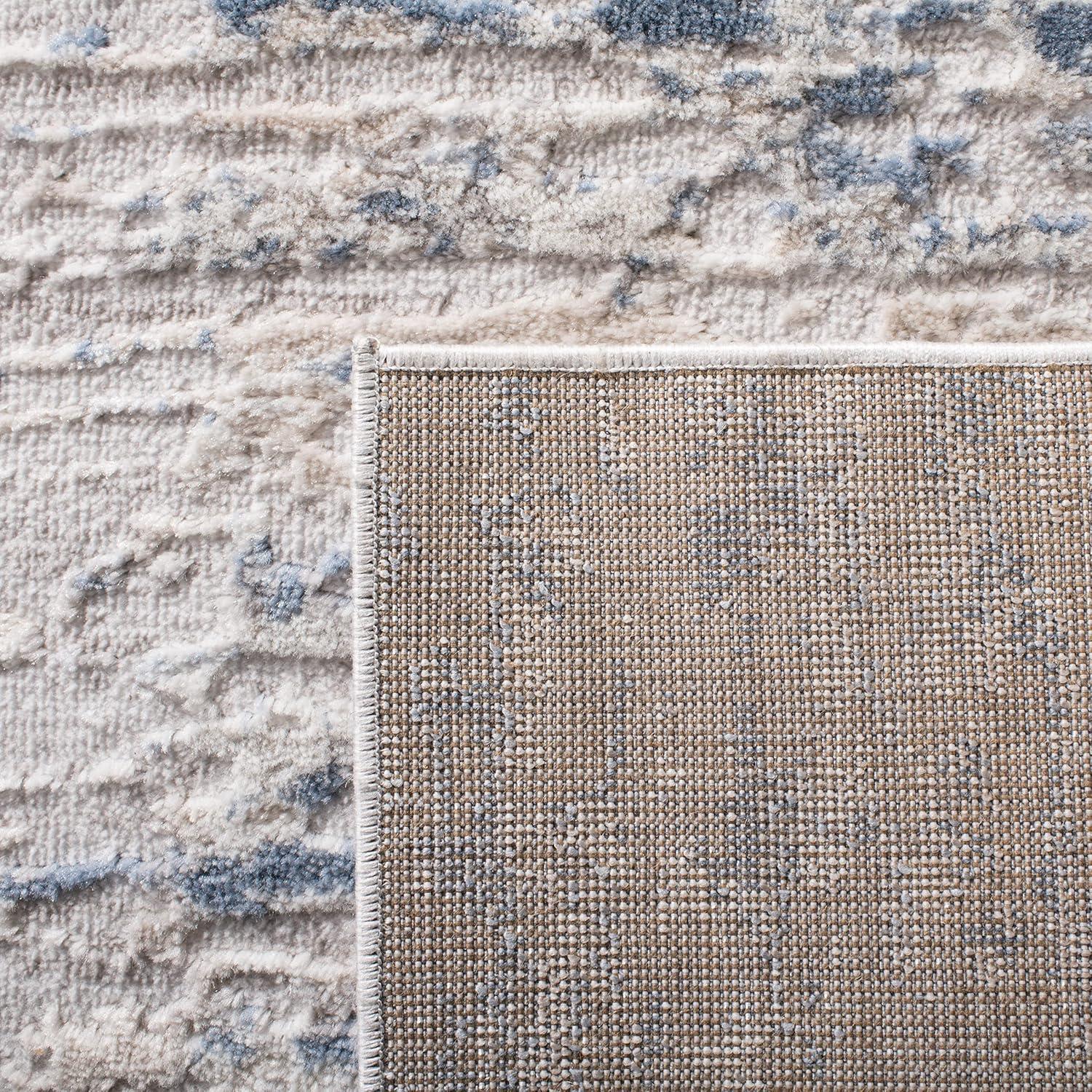 Ivory and Blue Abstract Distressed 2'2" x 4' Area Rug