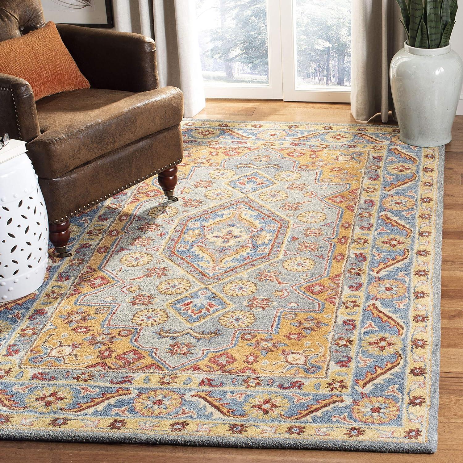 Antiquity AT504 Hand Tufted Area Rug - Blue/Gold - 5'x8' - Safavieh.