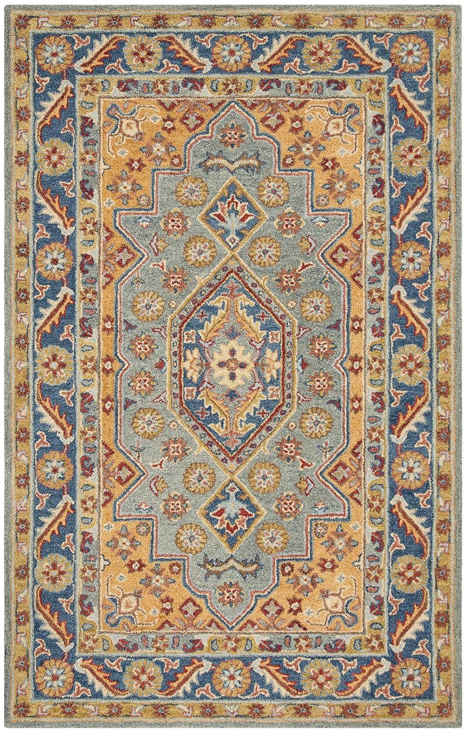 Antiquity AT504 Hand Tufted Area Rug - Blue/Gold - 5'x8' - Safavieh.