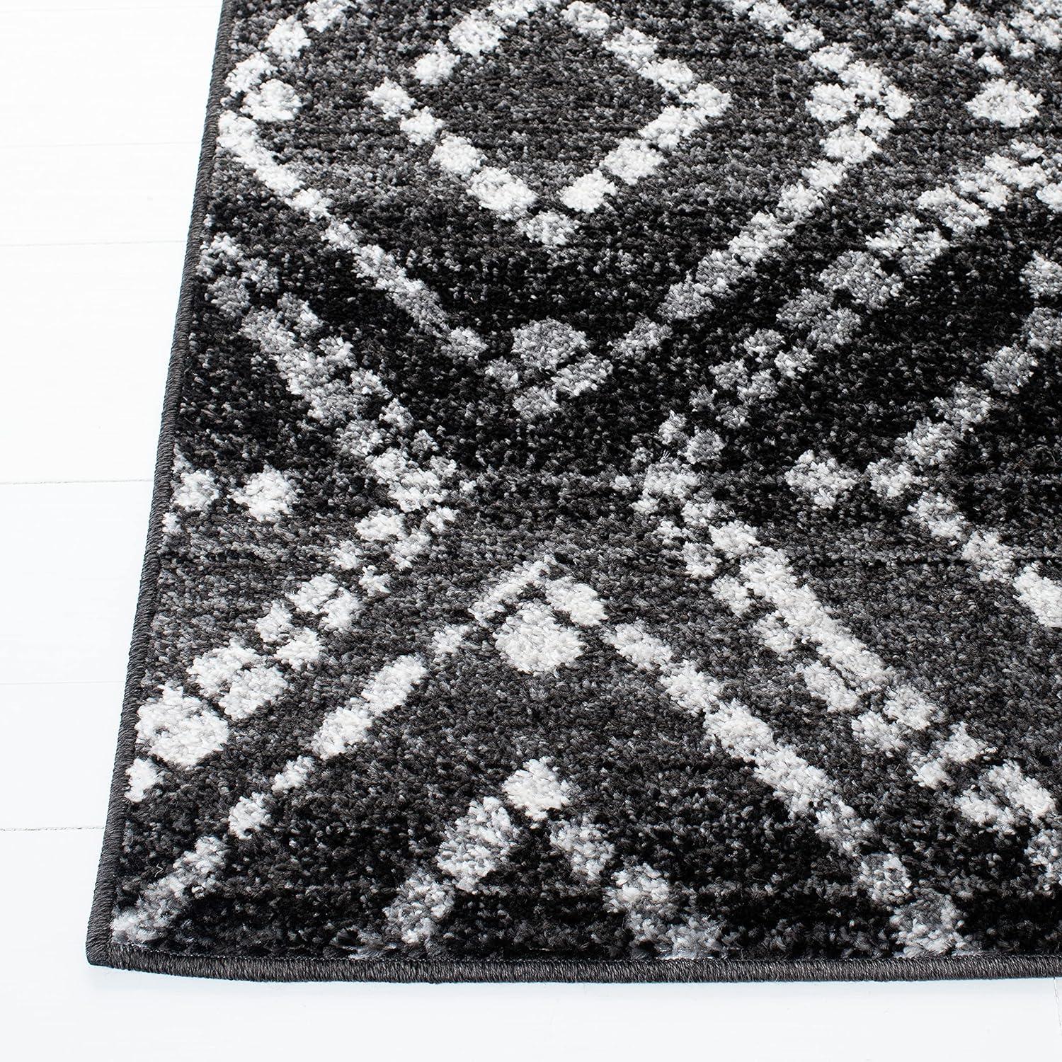 Black and Ivory Geometric Synthetic Rectangular Area Rug