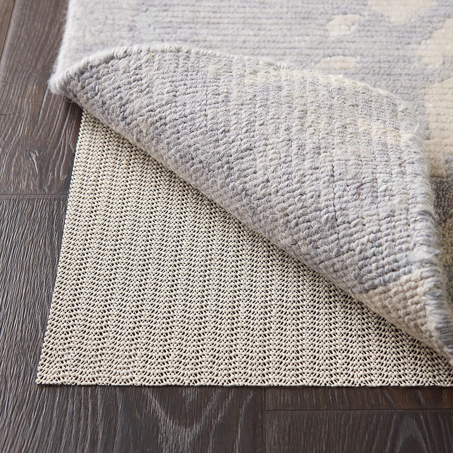 Ebern Designs Rectangle Shiftloc Solid Color Machine Made Polyester/Plastic/Acrylic Area Rug in Ivory
