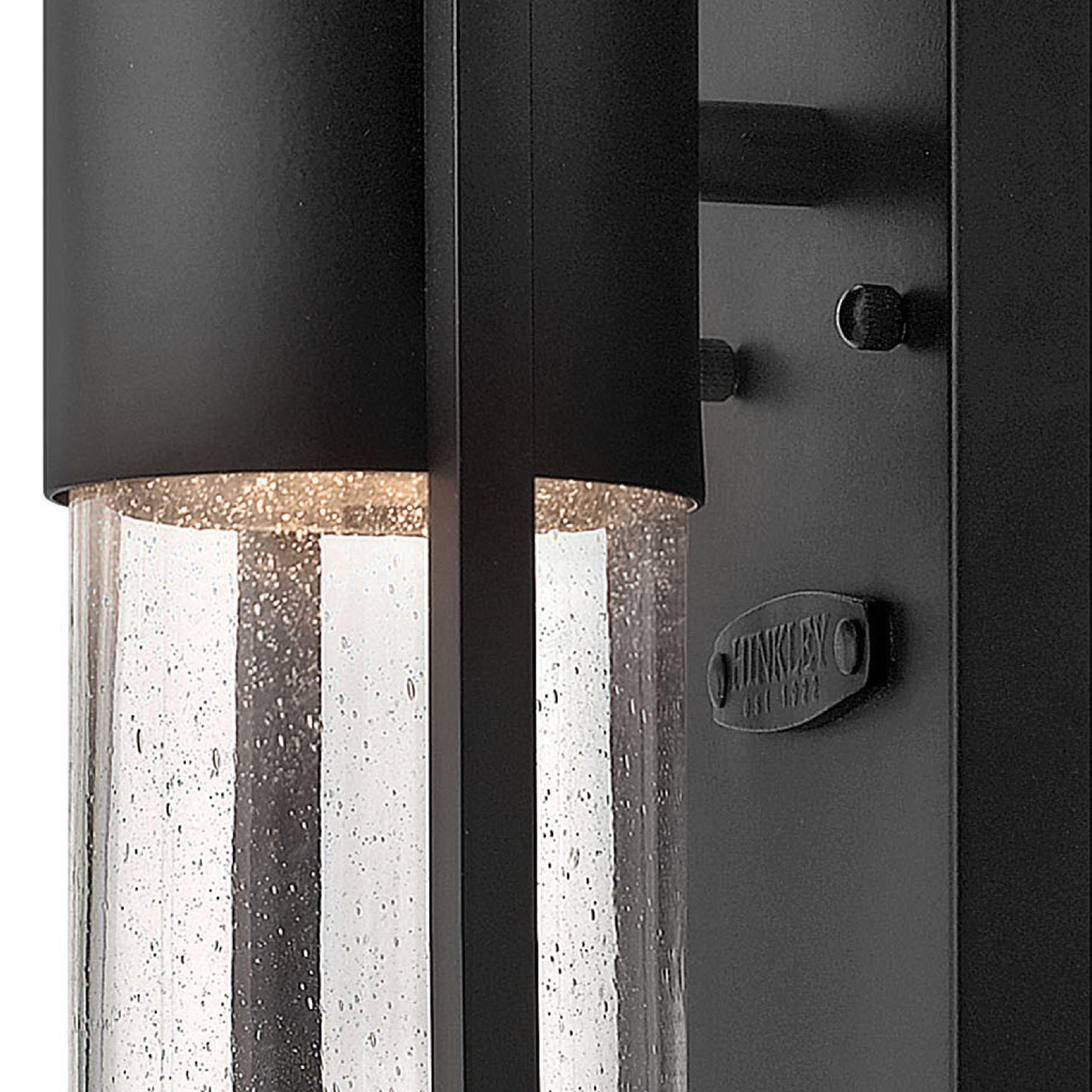Sleek Black Outdoor Wall Sconce with Clear Seedy Glass