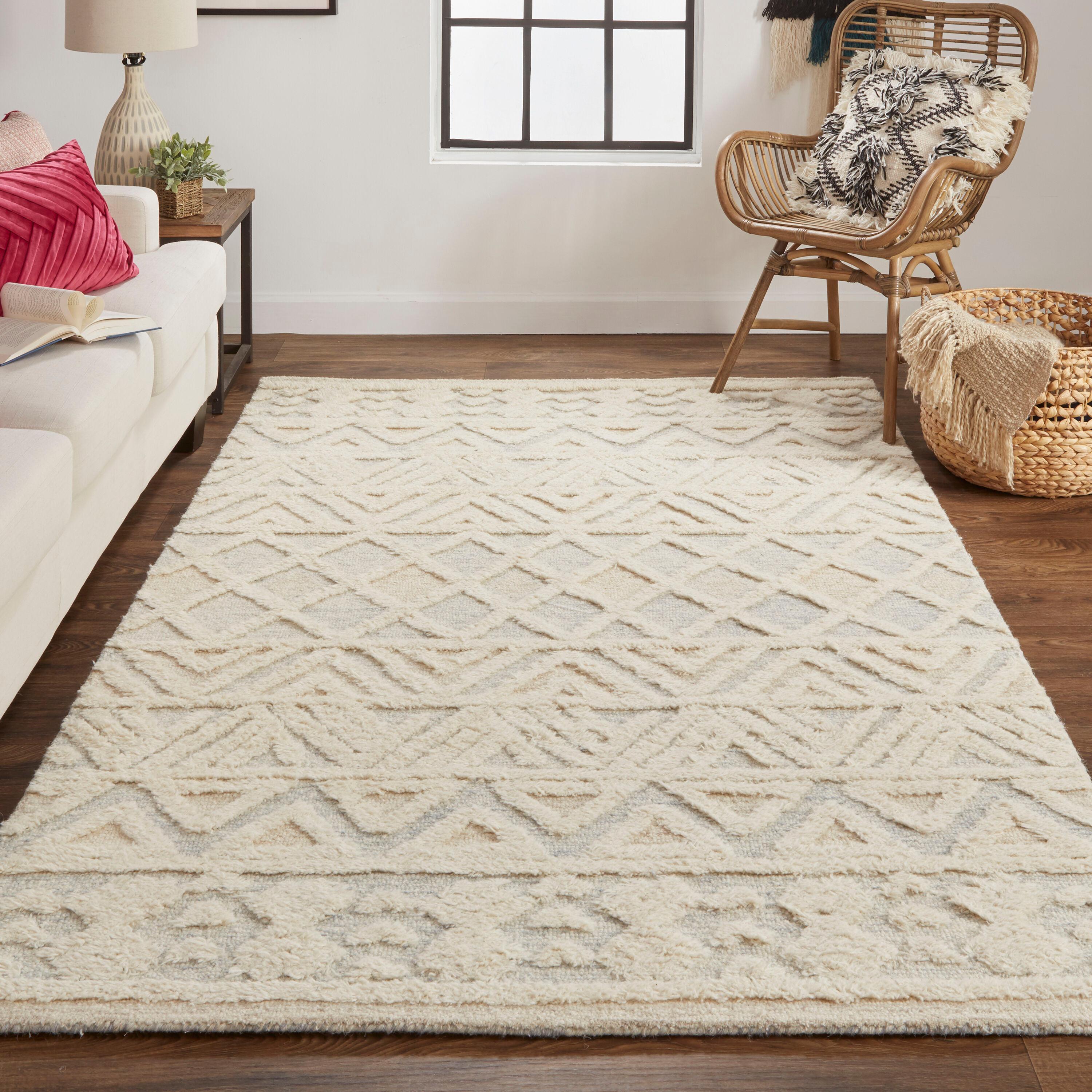 Elika 2' x 3' Blue and Ivory Wool Tufted Oval Rug
