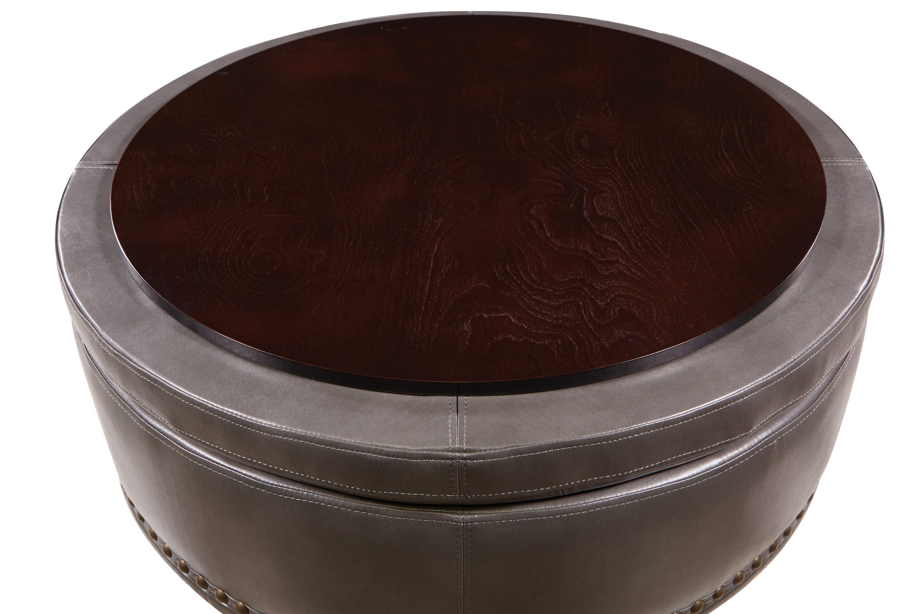 OSP Home Furnishings Augusta Round Storage Ottoman in Pewter Bonded Leather with decorative nailheads