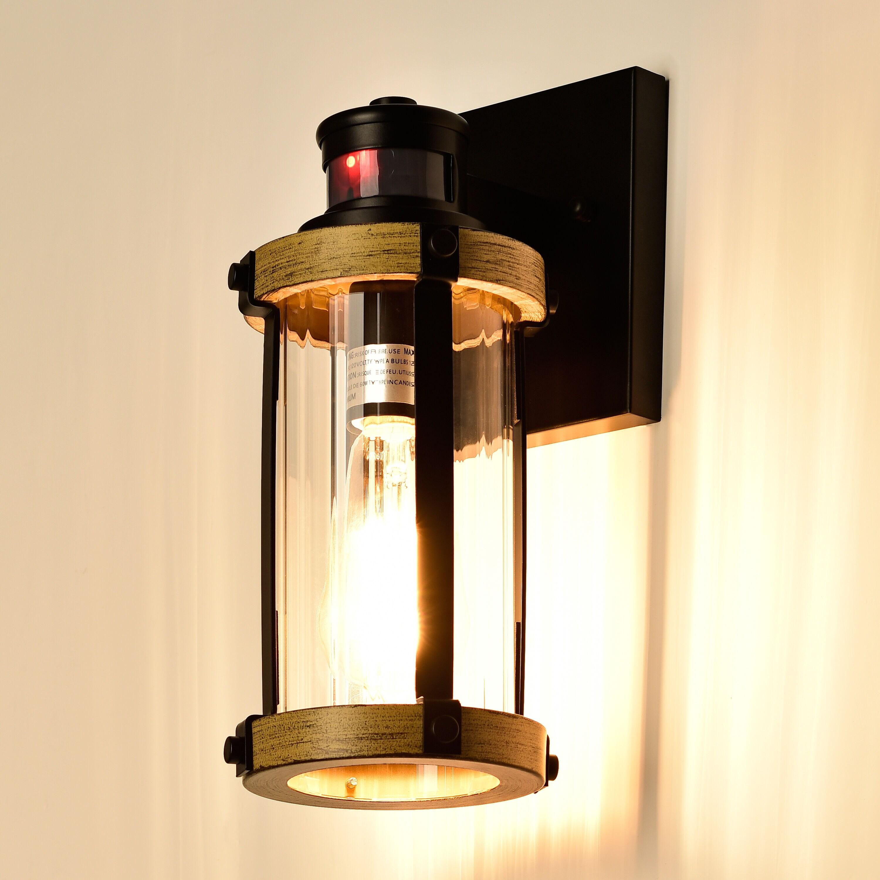 C Cattleya 5.5 in. 1-Light Motion Sensing Dusk to Dawn Outdoor Wall Sconce Black and Woodgrain Finish with Striped Clear Glass