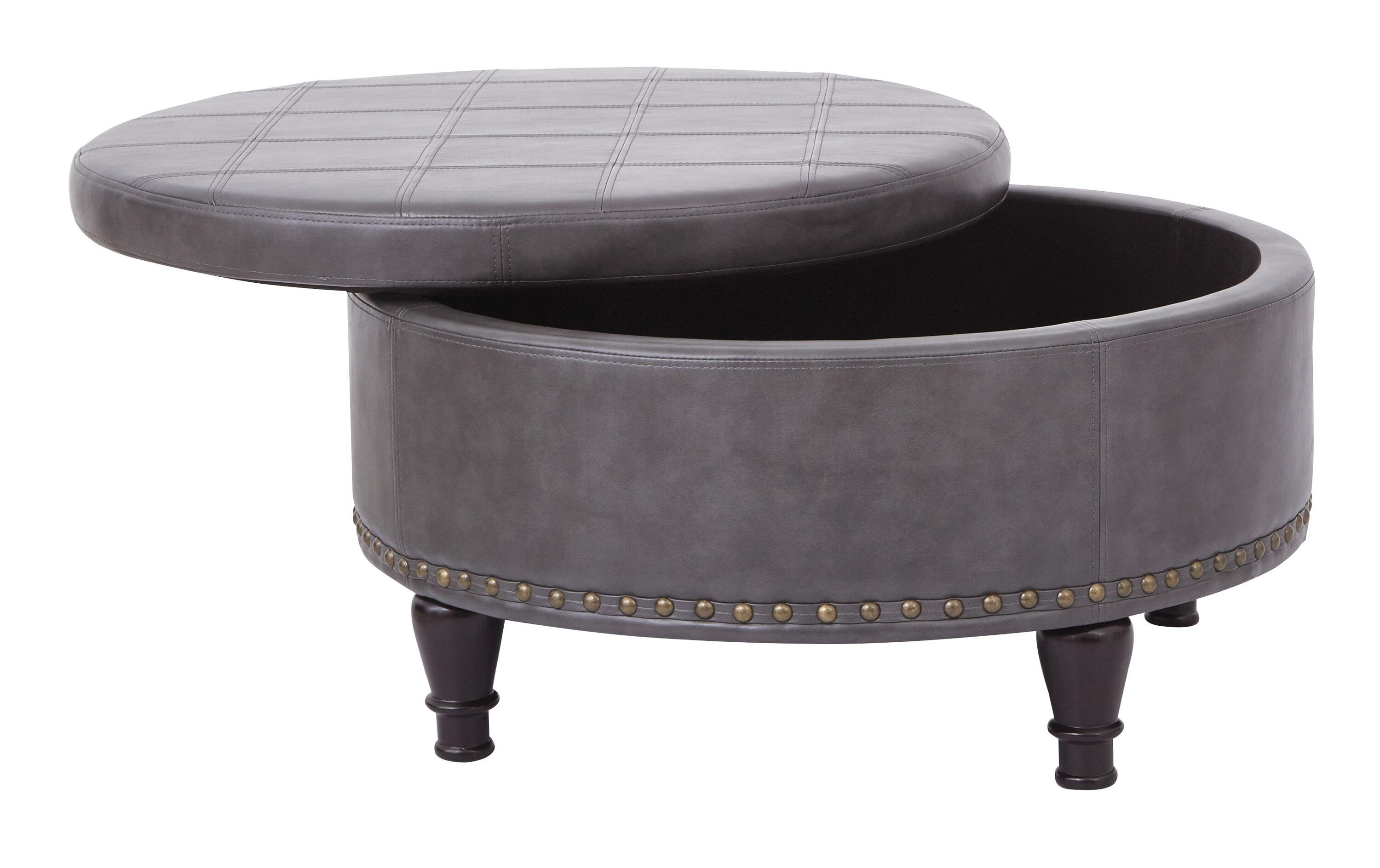 OSP Home Furnishings Augusta Round Storage Ottoman in Pewter Bonded Leather with decorative nailheads