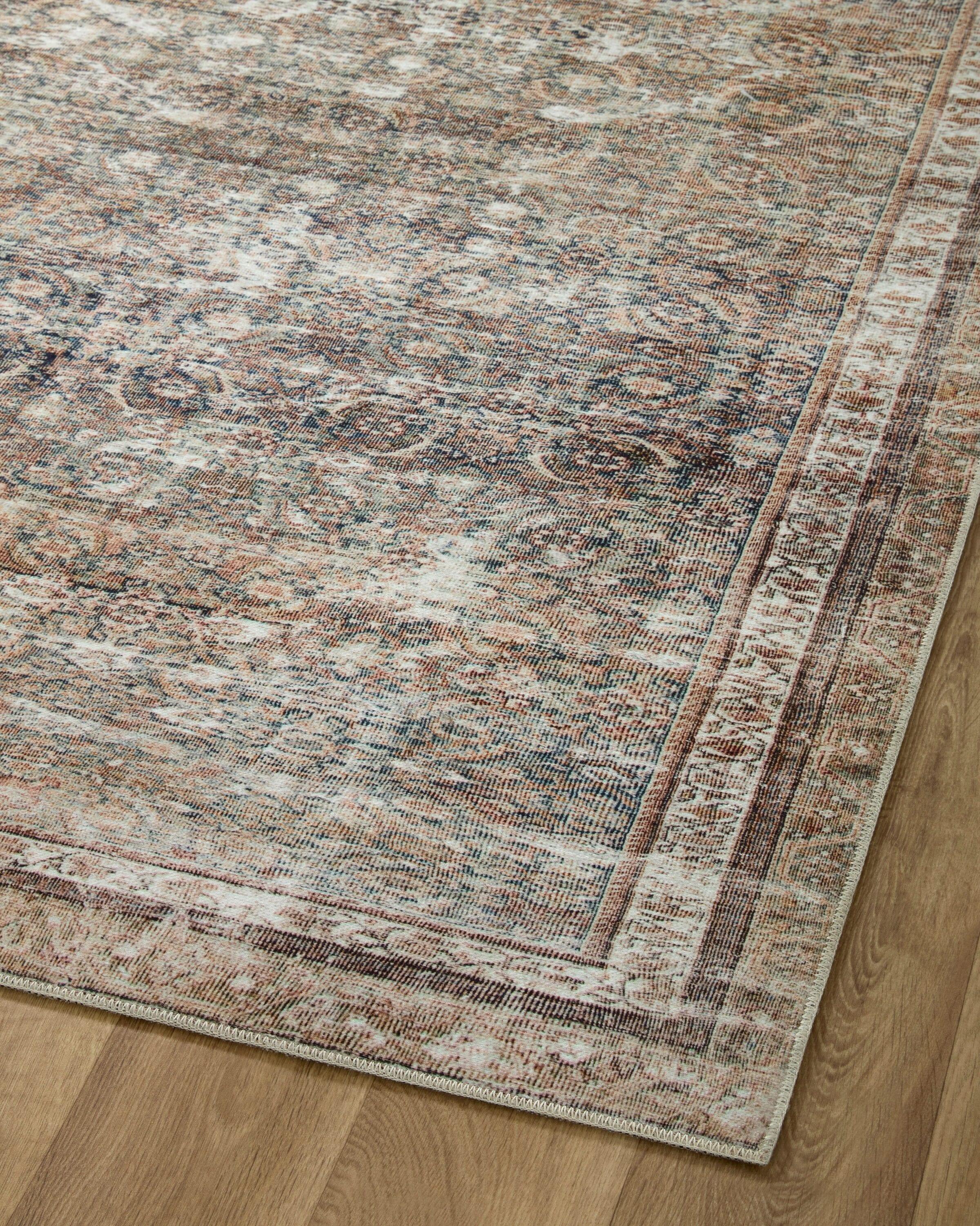 Jules Oriental Power Loomed Polyester Area Rug in Ink / Terracotta