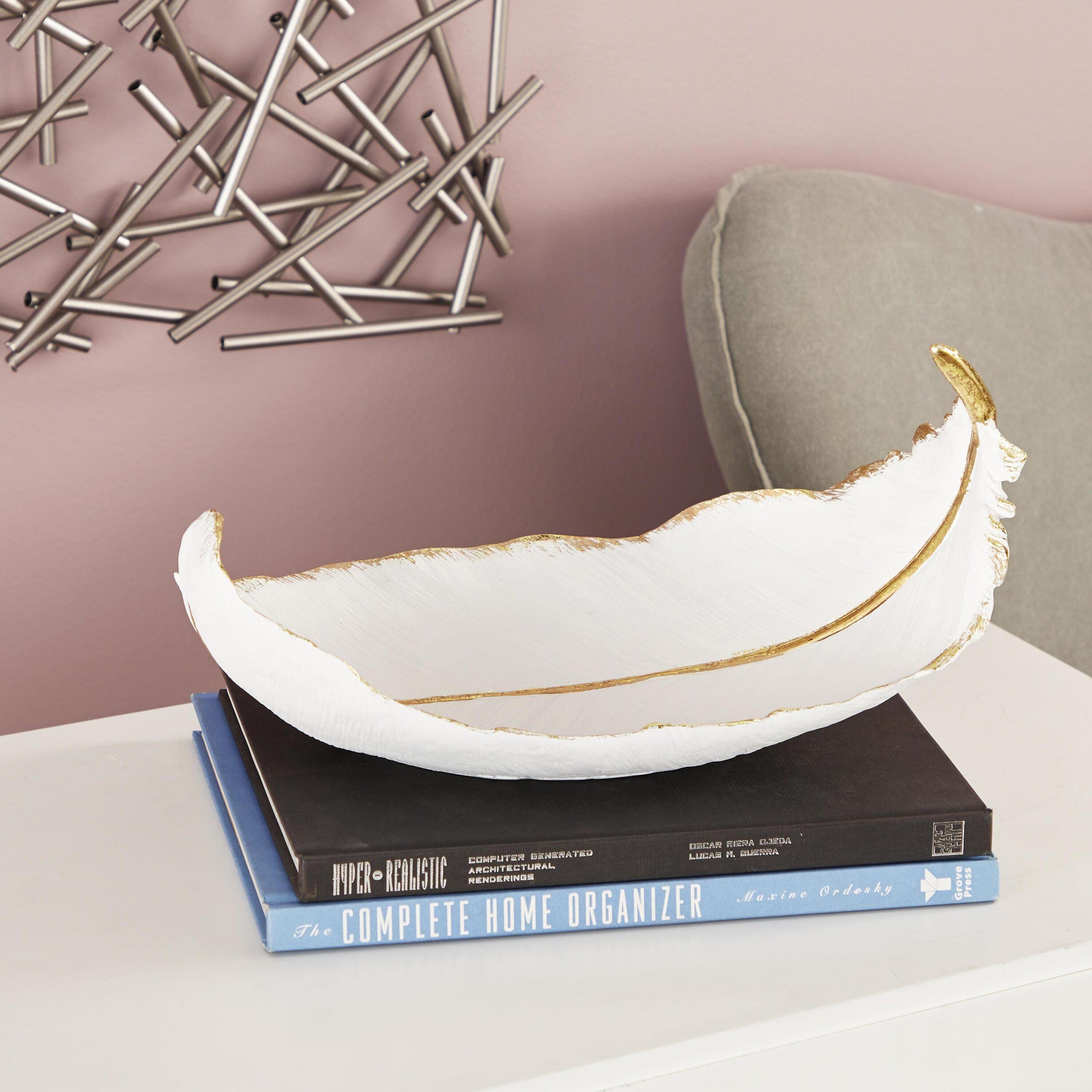 CosmoLiving by Cosmopolitan 8" Oval Curved Feather Bird Polystone Decorative Bowl with Gold Accents