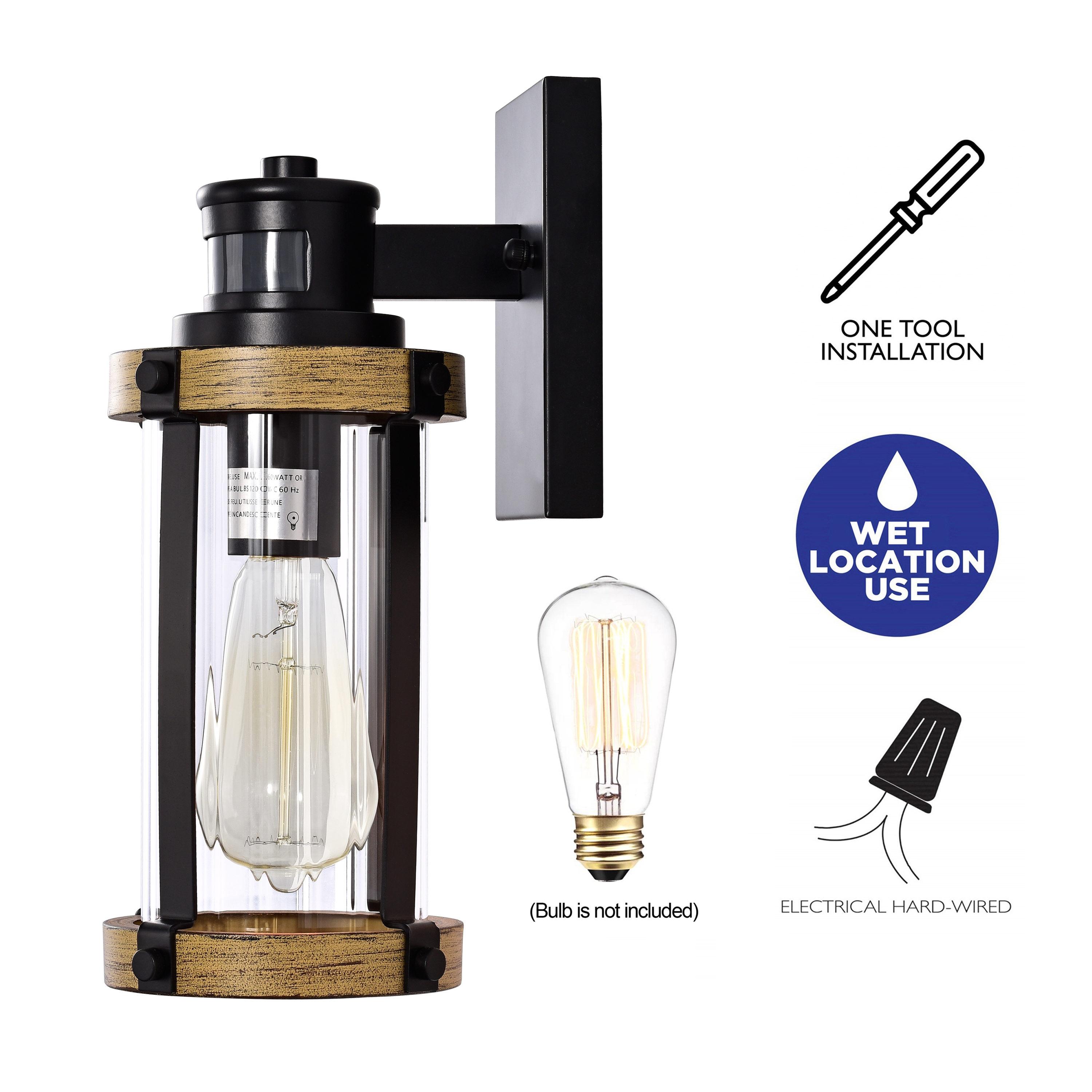 C Cattleya 5.5 in. 1-Light Motion Sensing Dusk to Dawn Outdoor Wall Sconce Black and Woodgrain Finish with Striped Clear Glass