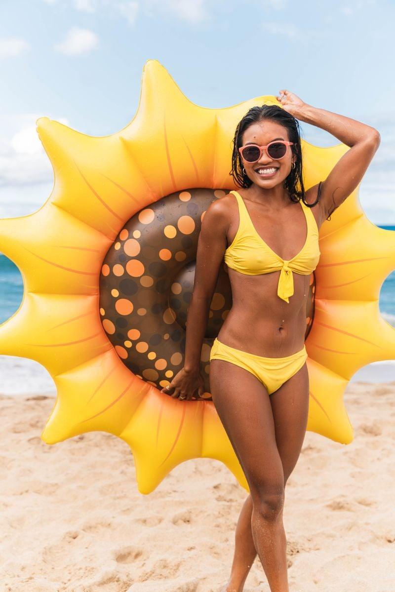 Get Ready for Summer Fun with PoolCandy's Inflatable Sunflower Island Pool Float - Perfect for Parties and Relaxation. The Ultimate Swimming Pool Inflatable Toy.