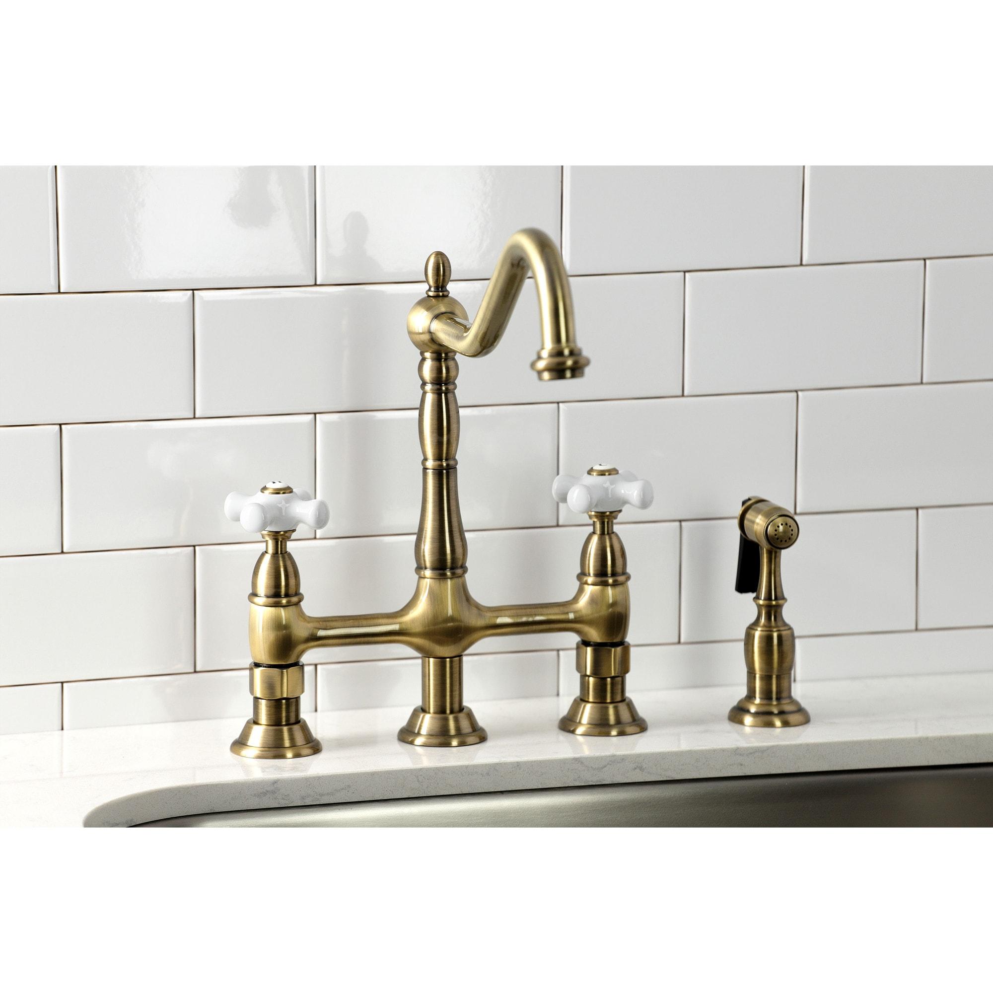 Kingston Brass Heritage Two-Handle 4-Hole Deck Mount Bridge Kitchen Faucet with Brass Side Sprayer