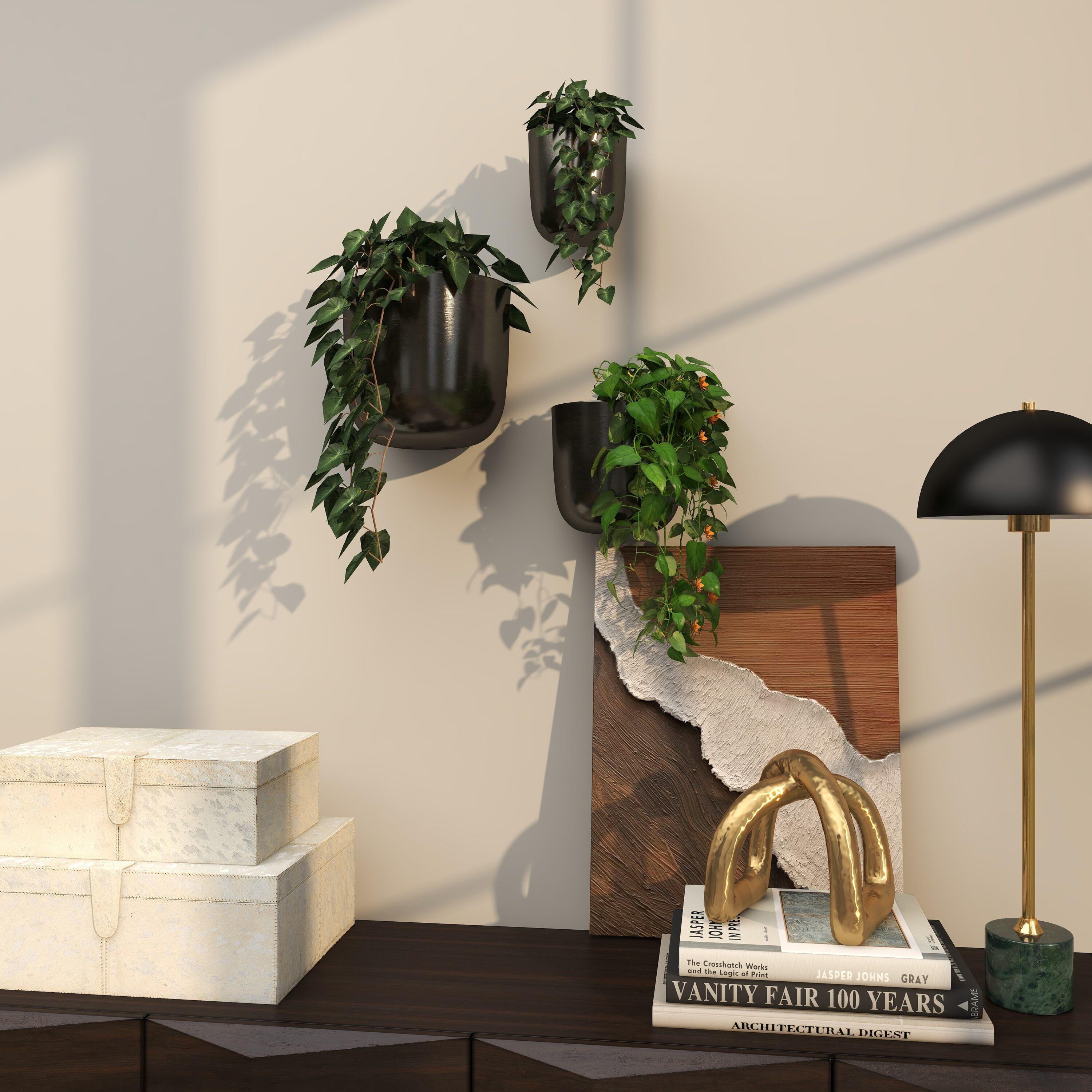 DecMode 9", 7", 6"H Round Black Metal Indoor Outdoor Floating Wall Planter (3 Count)