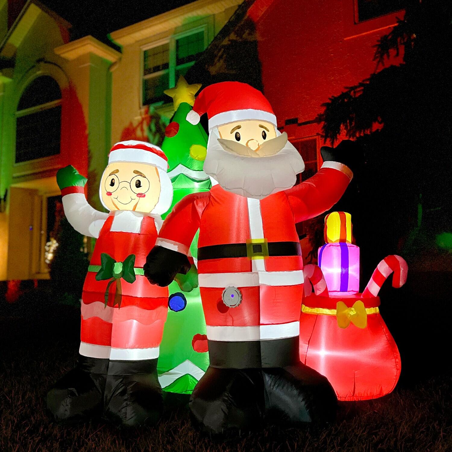 Fraser Hill Farm 6-Ft. Tall Prelit Mr. and Mrs. Claus with Tree Inflatable with Music