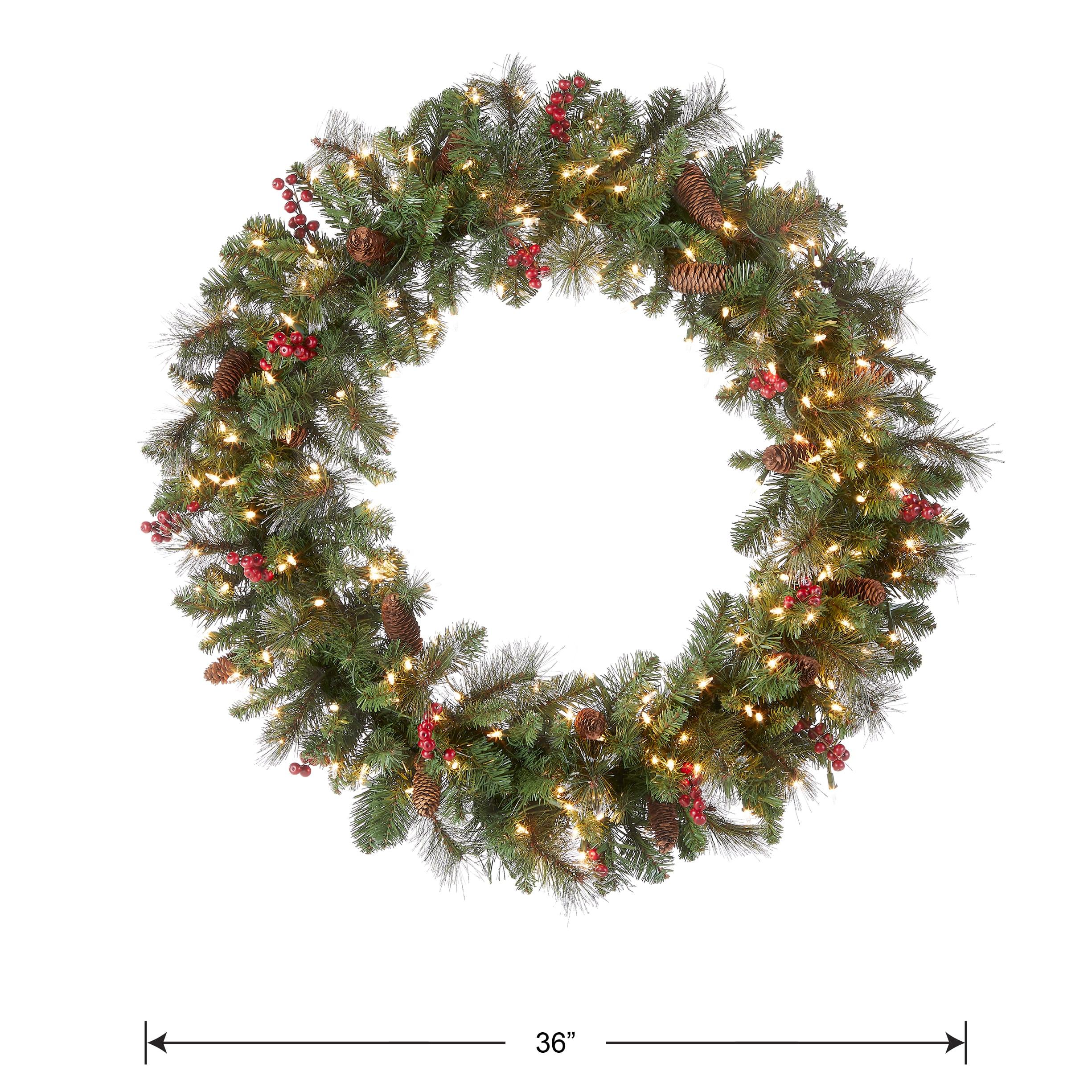 National Tree Company Pre-Lit Artificial Christmas Wreath, Green, Crestwood® Spruce , Clear Lights, Decorated with Pine Cones, Berry Clusters, Frosted Branches,  36 Inches