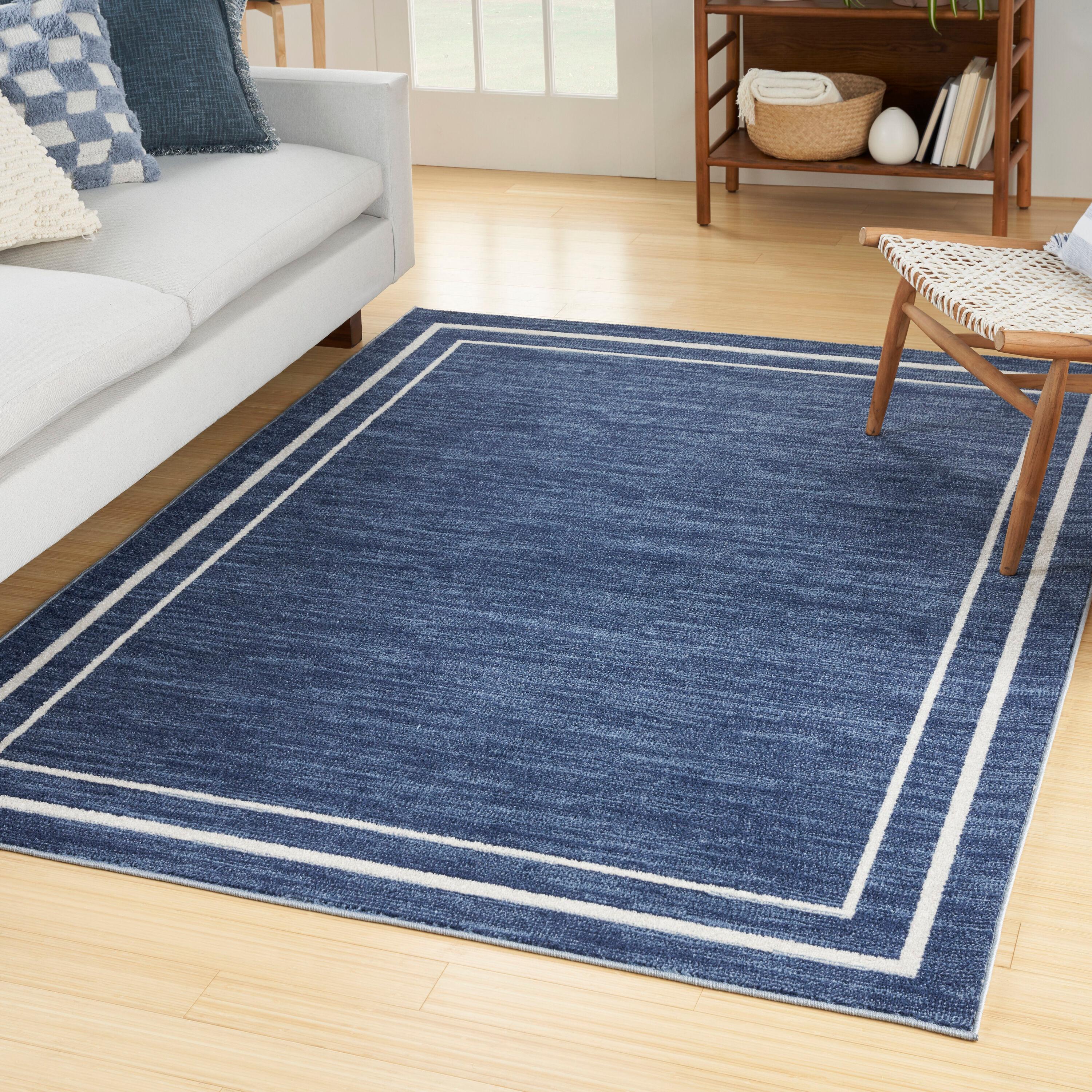 Nourison Essentials Solid Bordered Low Pile Indoor Outdoor Area Rug 6' x 9' Navy/Ivory