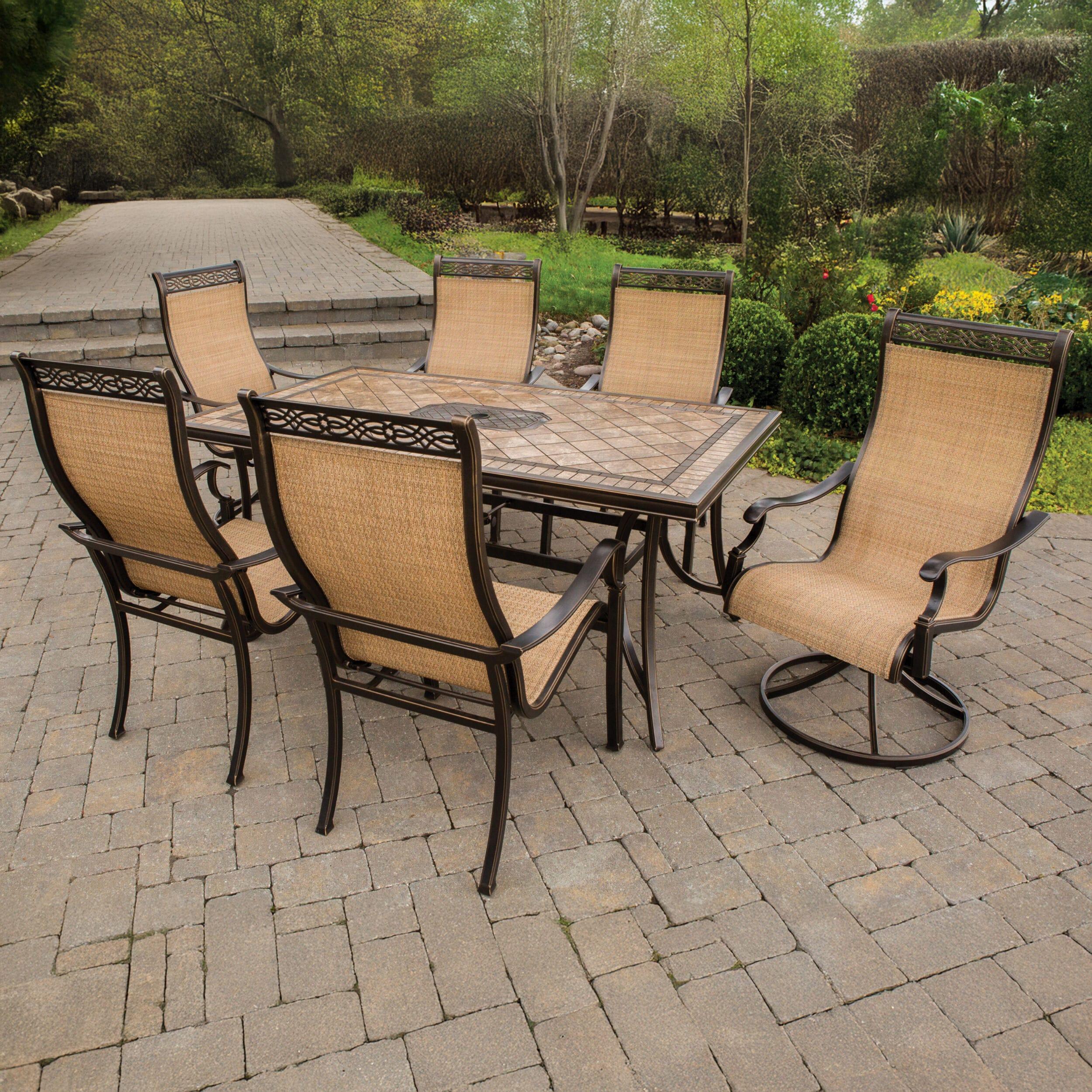 Hanover Monaco 7-Piece Outdoor Patio Dining Set with 4 PVC Sling Dining Chairs, 2 Swivel Rockers, and 40" x 68" Porcelain Tile Rectangular Dining Table | MONACO7PCSW