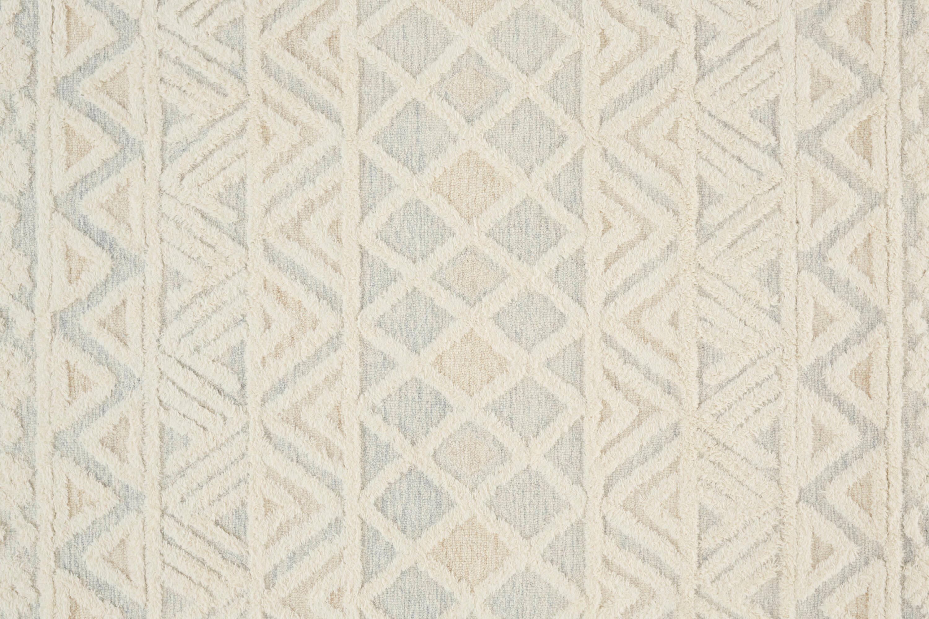 Elika 2' x 3' Blue and Ivory Wool Tufted Oval Rug
