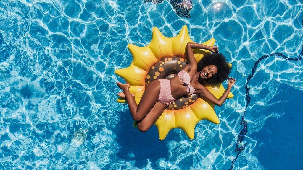 Get Ready for Summer Fun with PoolCandy's Inflatable Sunflower Island Pool Float - Perfect for Parties and Relaxation. The Ultimate Swimming Pool Inflatable Toy.