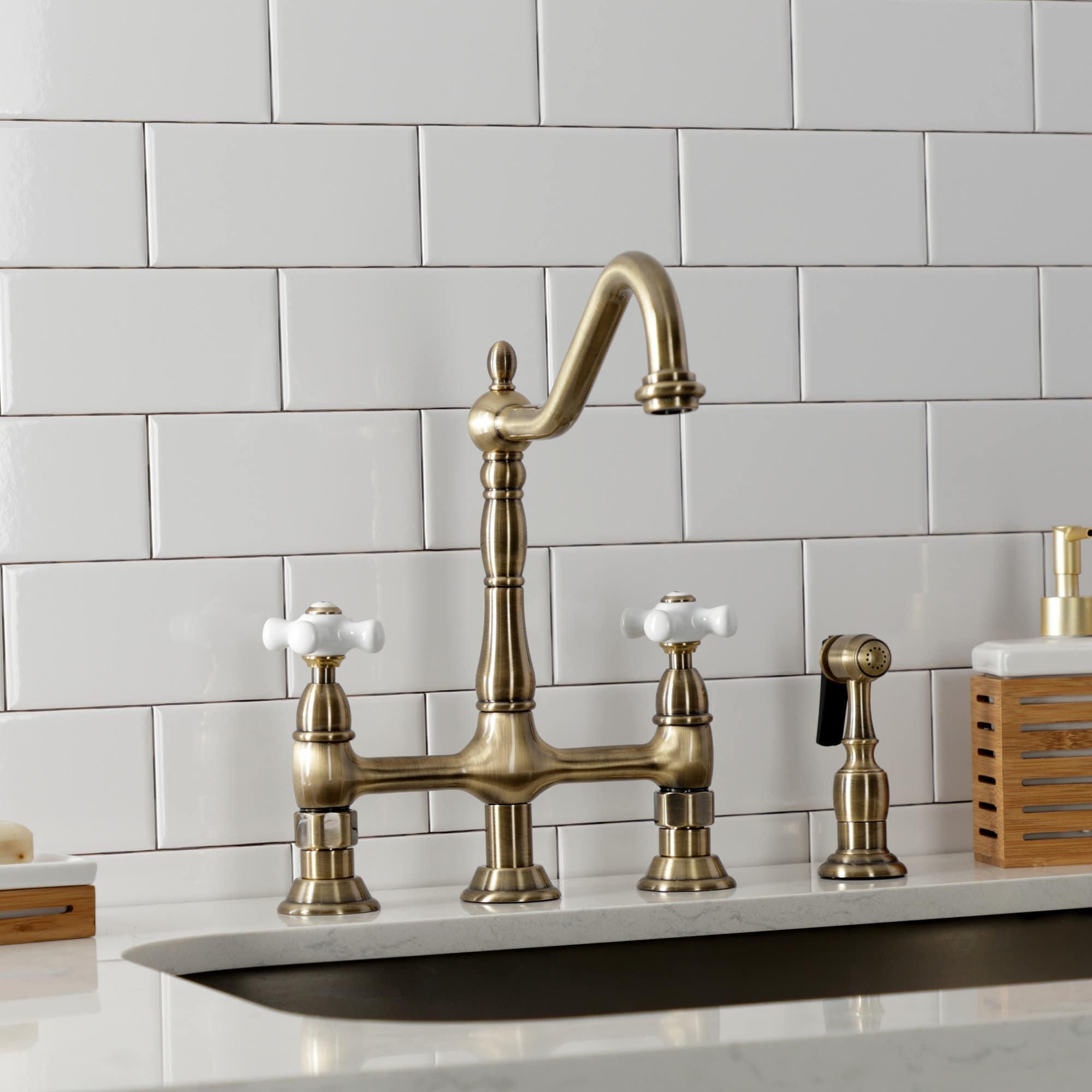 Kingston Brass Heritage Two-Handle 4-Hole Deck Mount Bridge Kitchen Faucet with Brass Side Sprayer