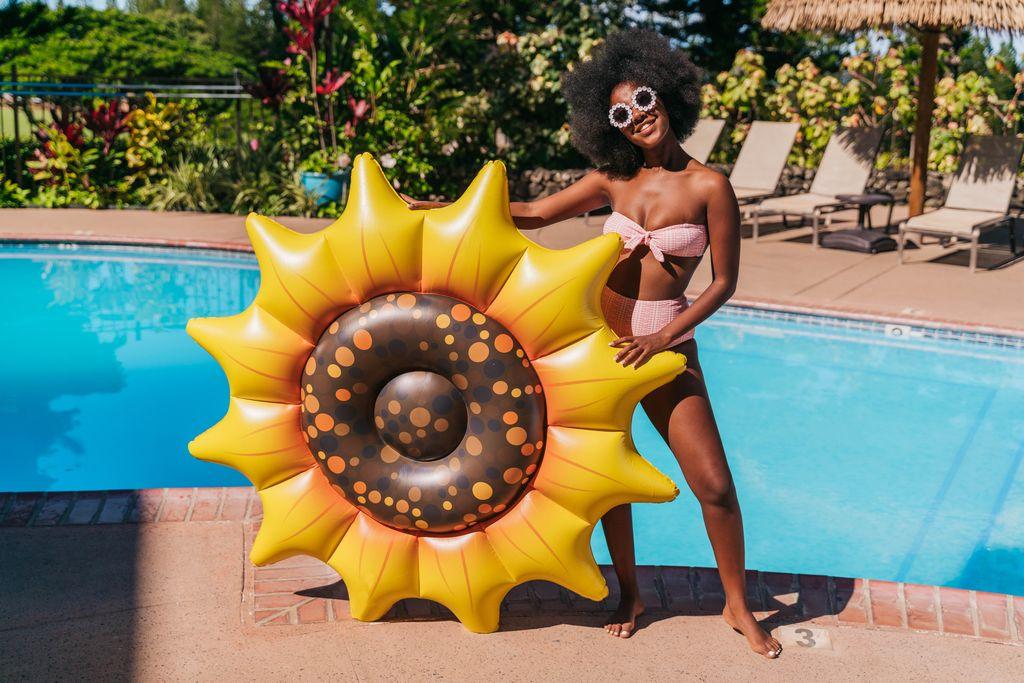 Get Ready for Summer Fun with PoolCandy's Inflatable Sunflower Island Pool Float - Perfect for Parties and Relaxation. The Ultimate Swimming Pool Inflatable Toy.
