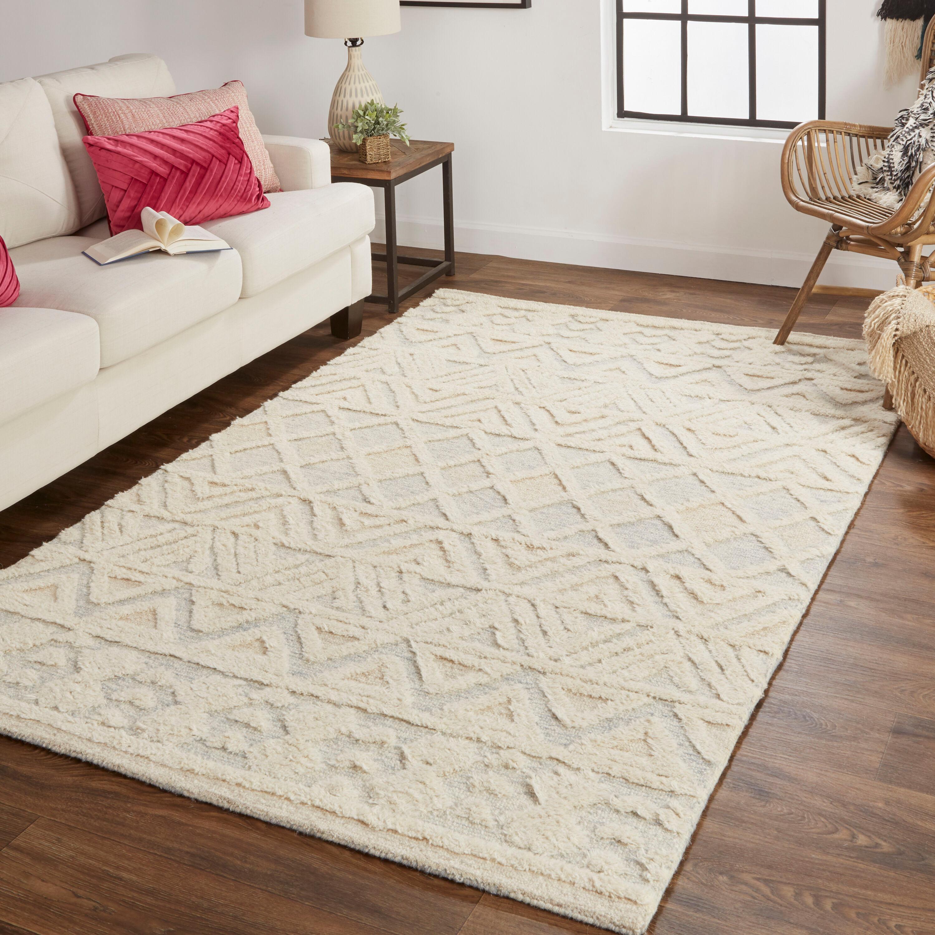 Elika 2' x 3' Blue and Ivory Wool Tufted Oval Rug