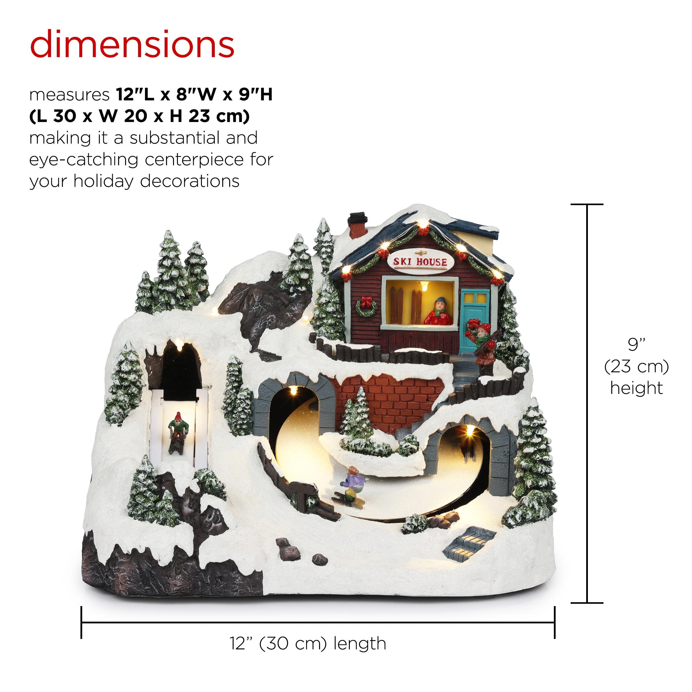 Alpine Corporation Animated Christmas Ski Resort Holiday Tabletop Decor with 12 Warm White LED Lights and Moving Skier Figurines, 12" L x 8" W x 9" H