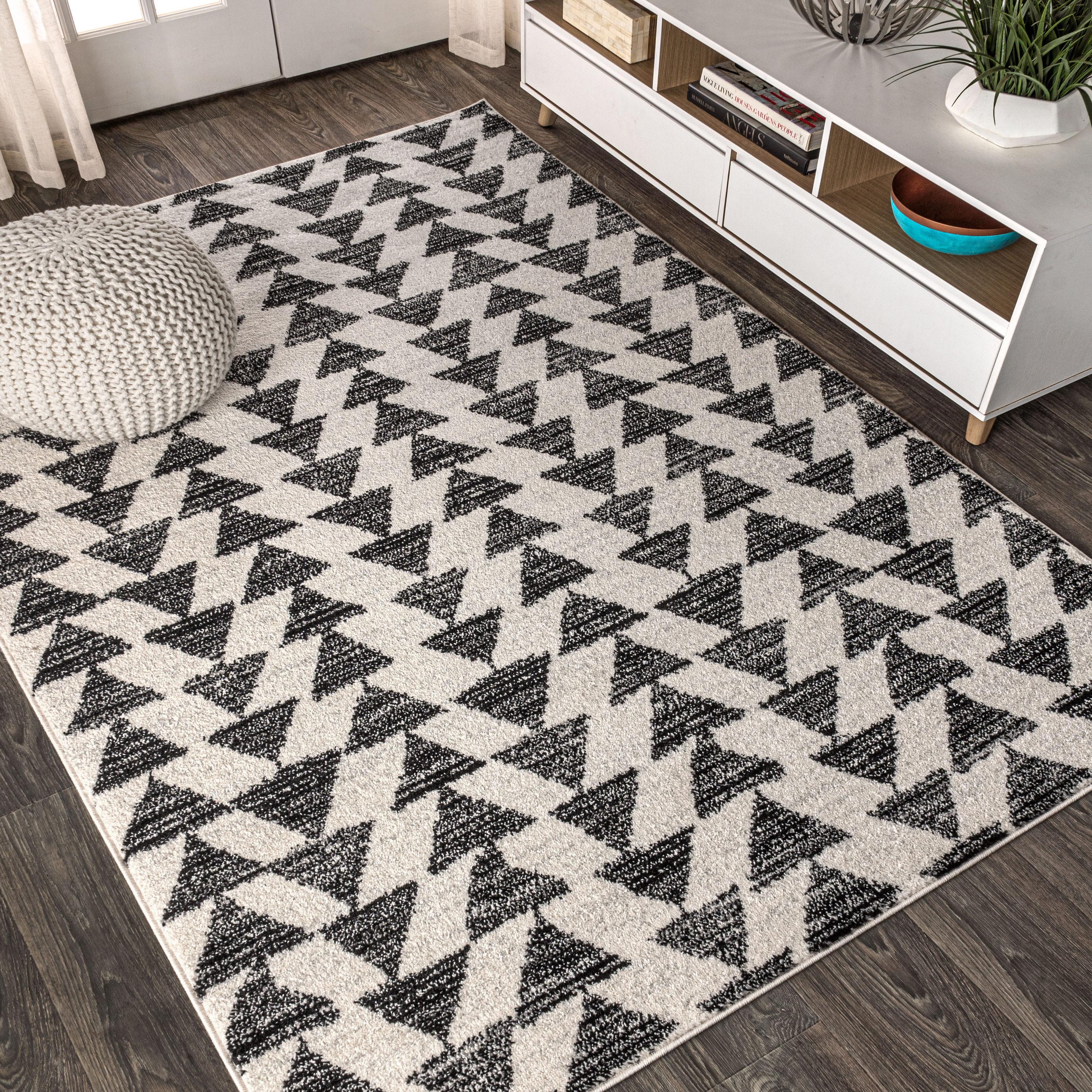 Aisha Cream and Black Geometric 10' x 14' Synthetic Area Rug