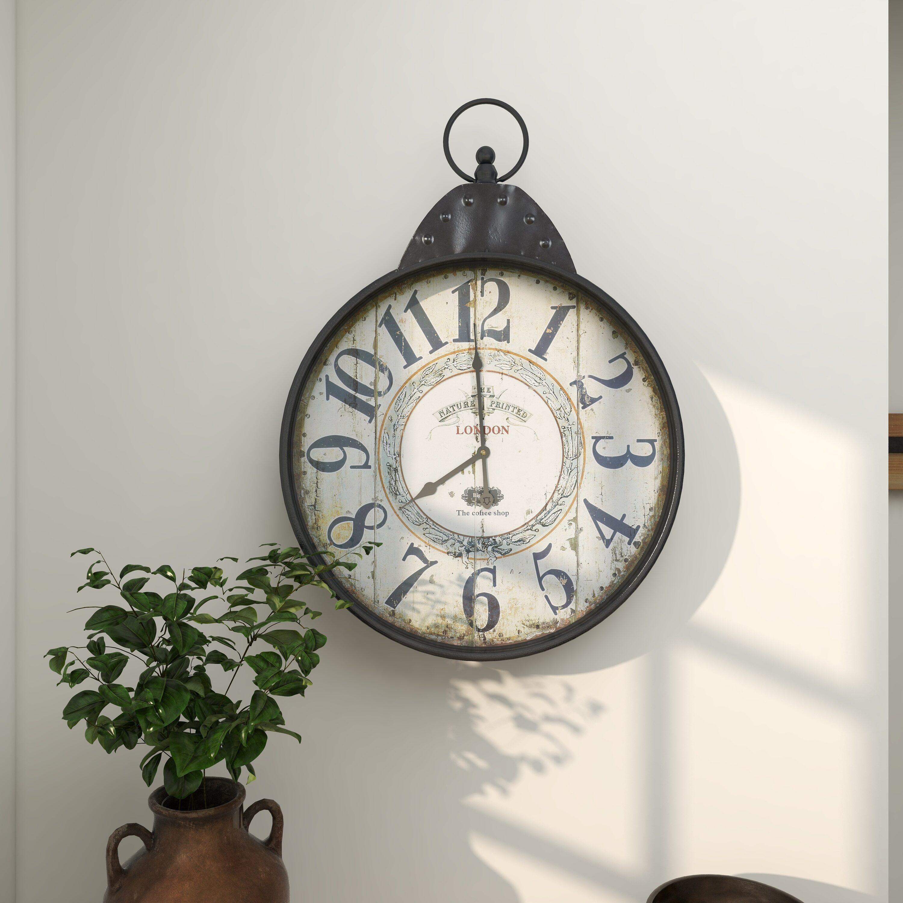 DecMode 20" Black Metal Finial Distressed Pocket Watch Inspired Wall Clock with Beige Clockface