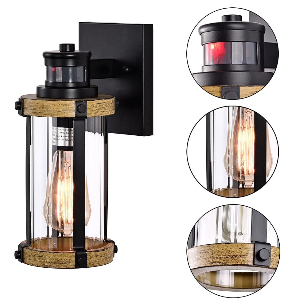 C Cattleya 5.5 in. 1-Light Motion Sensing Dusk to Dawn Outdoor Wall Sconce Black and Woodgrain Finish with Striped Clear Glass