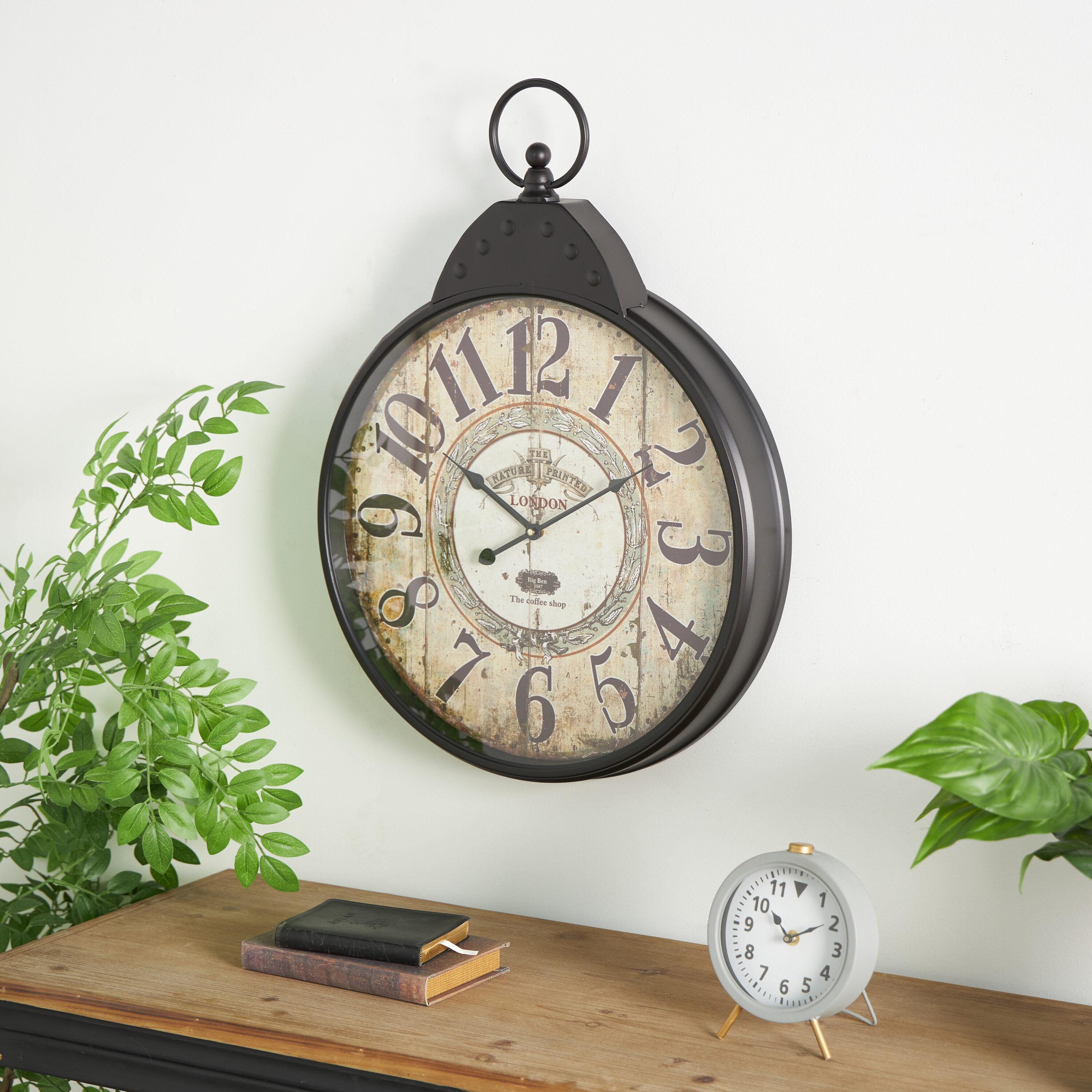 DecMode 20" Black Metal Finial Distressed Pocket Watch Inspired Wall Clock with Beige Clockface