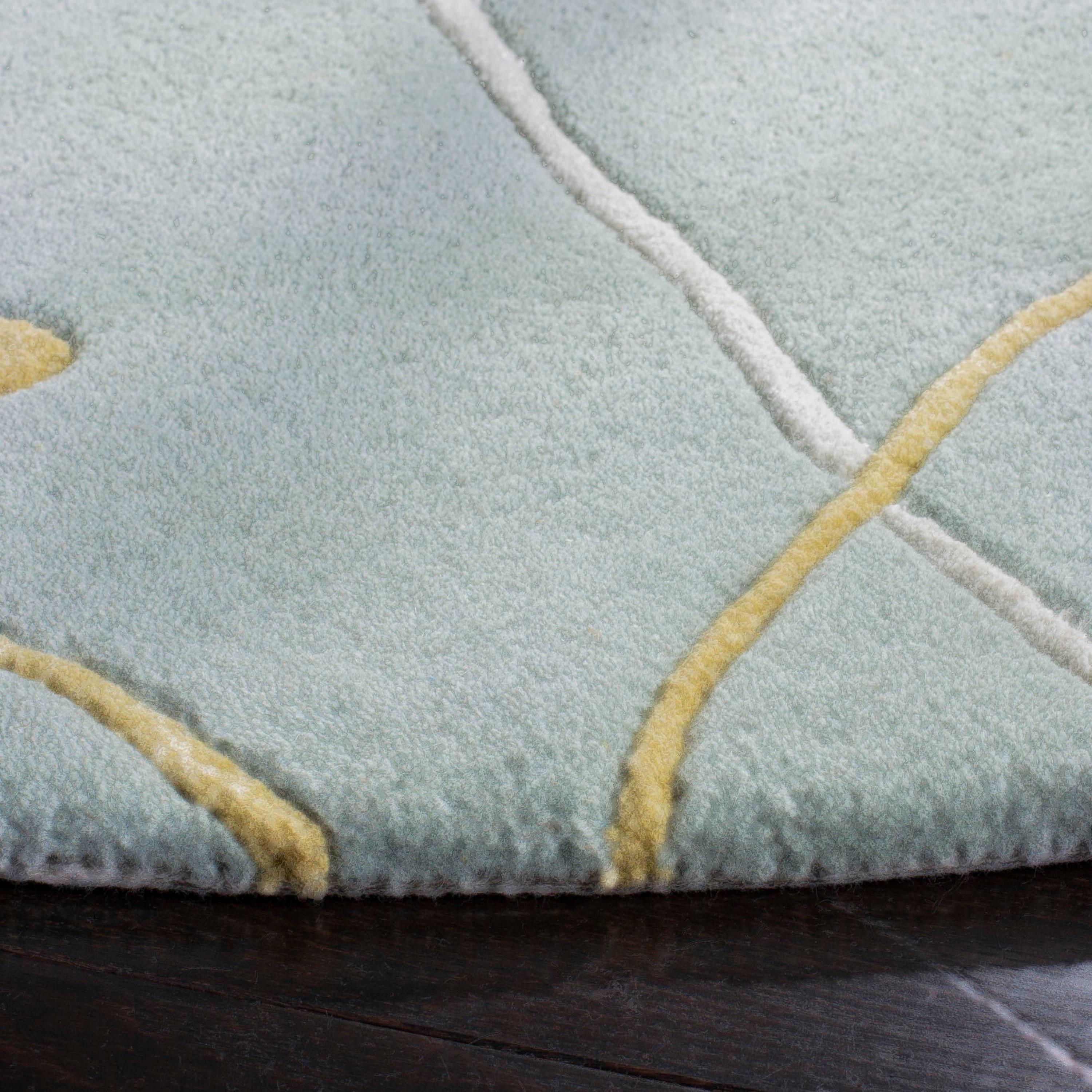 Soho SOH305 Hand Tufted Area Rug - Light Blue - 8' round - Safavieh.