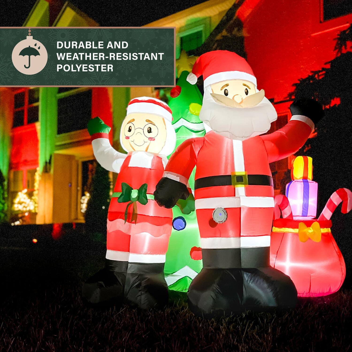 Fraser Hill Farm 6-Ft. Tall Prelit Mr. and Mrs. Claus with Tree Inflatable with Music