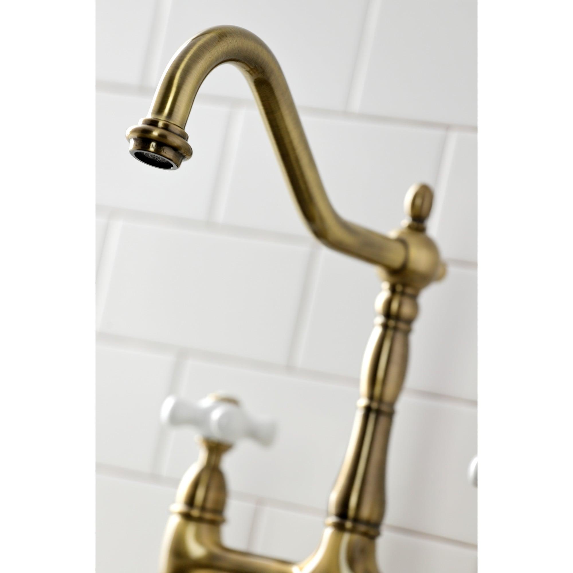 Kingston Brass Heritage Two-Handle 4-Hole Deck Mount Bridge Kitchen Faucet with Brass Side Sprayer