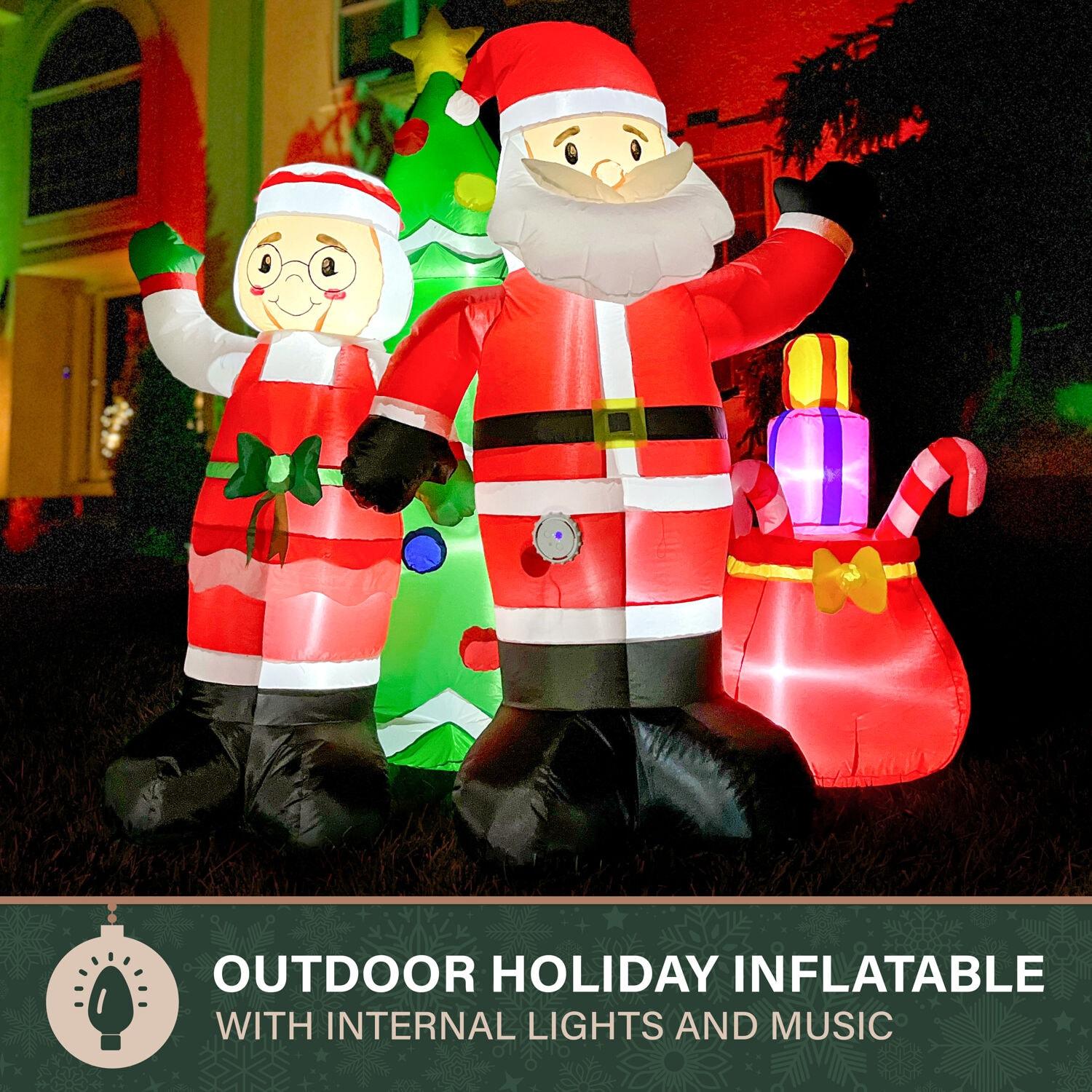 Fraser Hill Farm 6-Ft. Tall Prelit Mr. and Mrs. Claus with Tree Inflatable with Music
