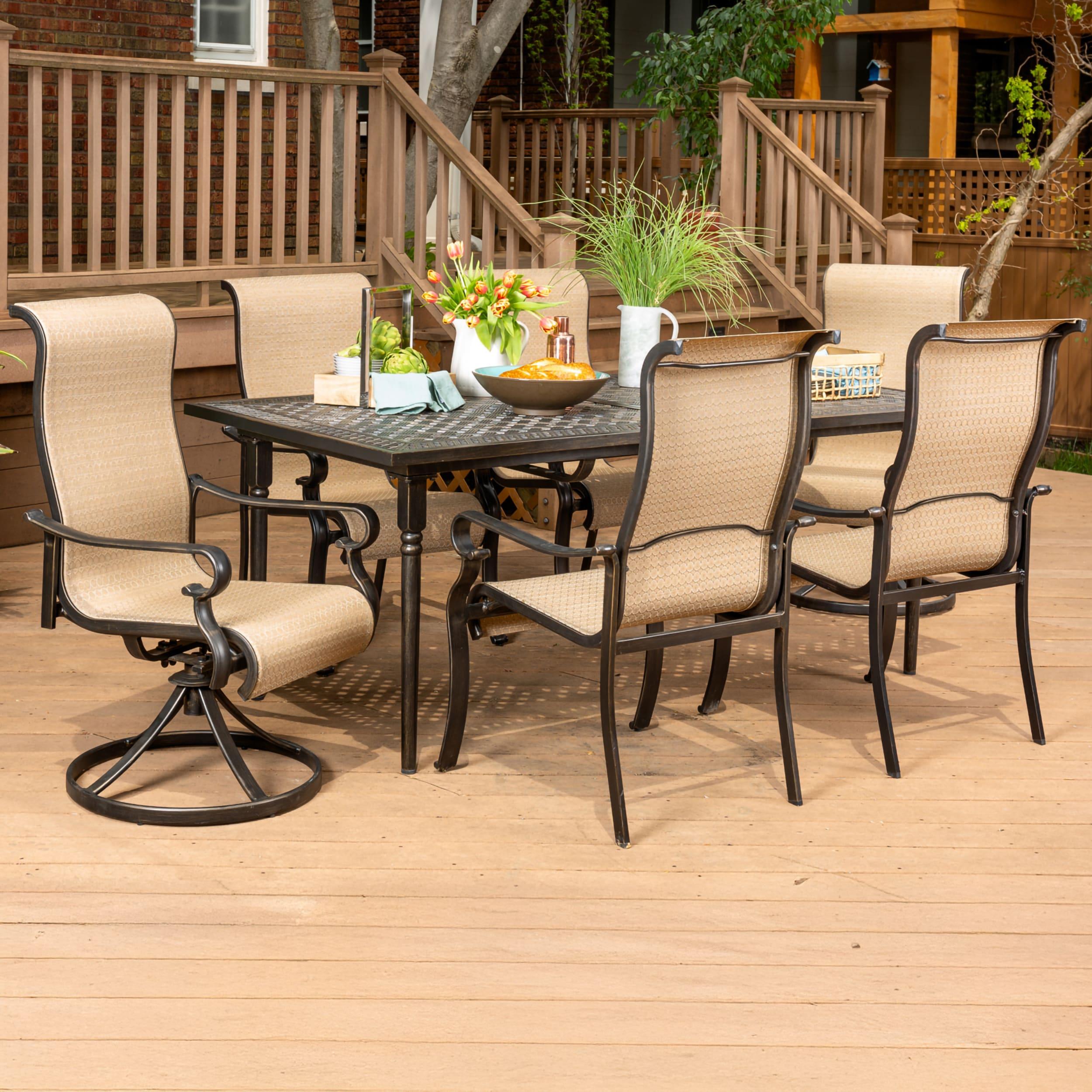 Hanover Brigantine Juego de Comedor Moderno para Exteriores de 7 Piezas / 4 Sillas con Cabestrillo, 2 Balancines Giratorios / Mesa con Tapa de 40'' x 70'' / Clima, Xido, Resistente a UV / Bronceado / BRIGDN7PCSW-2