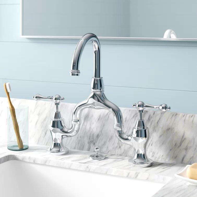 Kingston Brass English Country Two-Handle 3-Hole Deck Mount Bridge Bathroom Faucet with Brass Pop-Up